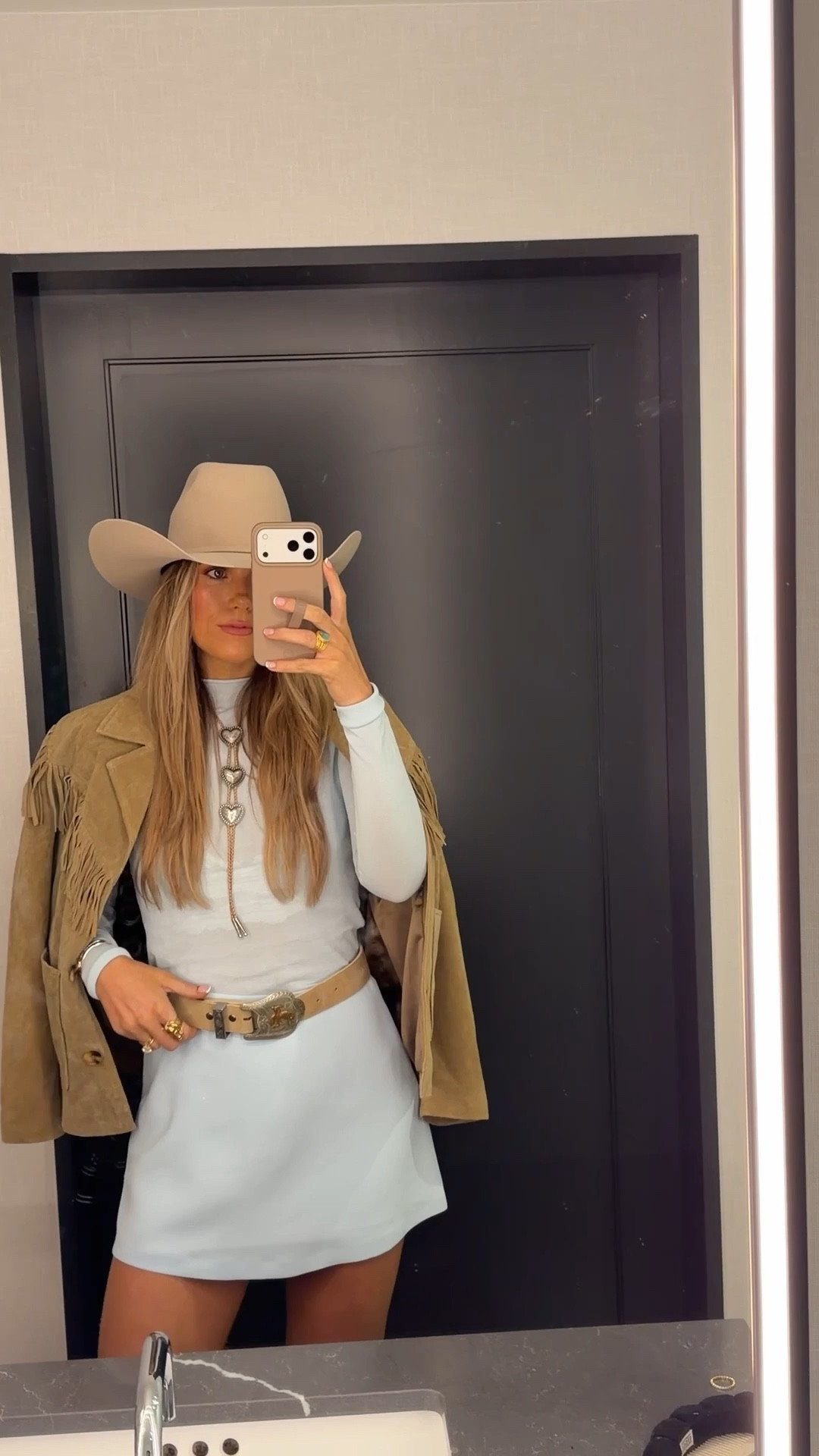 fort worth outfit! size small in top, small in fringe jacket, size 4 in skort, hat is from seratelli but linked similar! belt is from amazon but i added a vintage buckle to it! bolo is from november maker :)

#LTKFestival #LTKTall #LTKootd