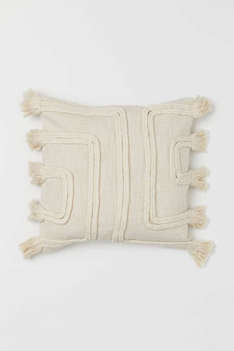 Conscious choice  Cushion cover in slub-weave fabric made from recycled cotton. Front section pat... | H&M (US + CA)