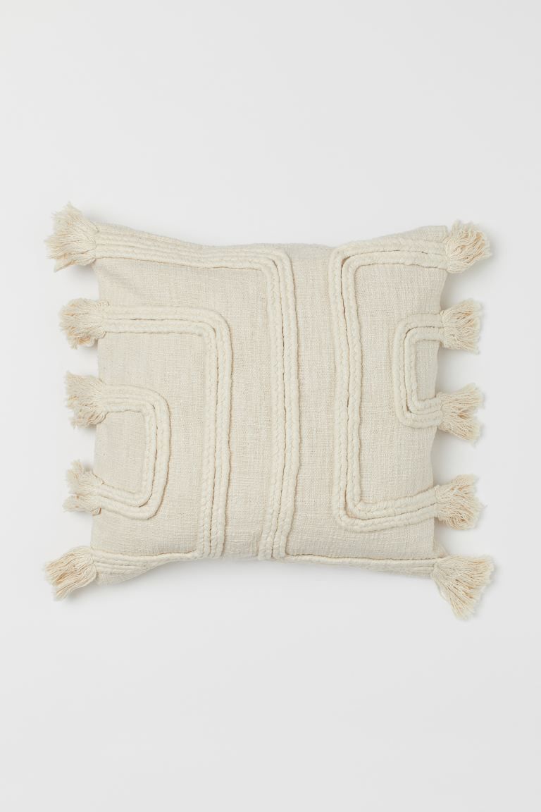 Cushion cover in slub-weave fabric made from recycled cotton. Front section patterned with braide... | H&M (US + CA)