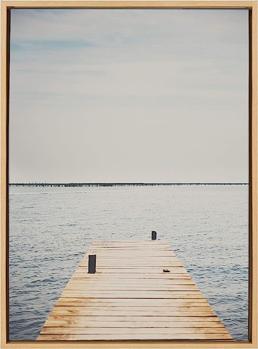 Kate and Laurel Sylvie Standing On Dock Framed Canvas Wall Art by Laura Evans, 23x33 Natural, Bea... | Amazon (US)