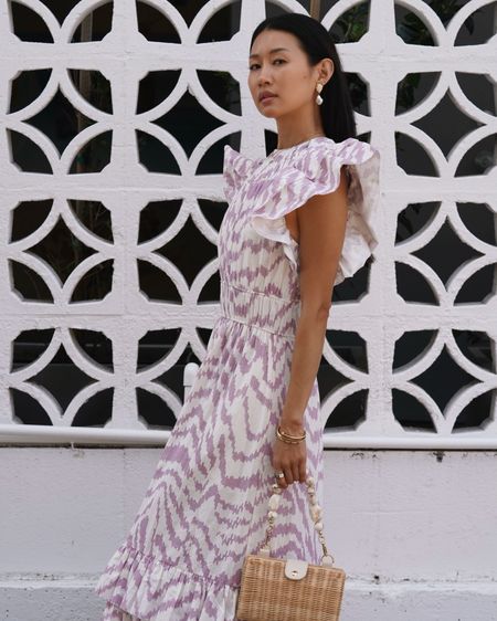 The prettiest spring dress for Easter, brunch, Mother’s Day, weddings and more. Love the flutter sleeves and the zebra print details.

Love these pearl earrings and minimal, white strappy heels for summer too!

#LTKwedding #LTKover40 #LTKstyletip