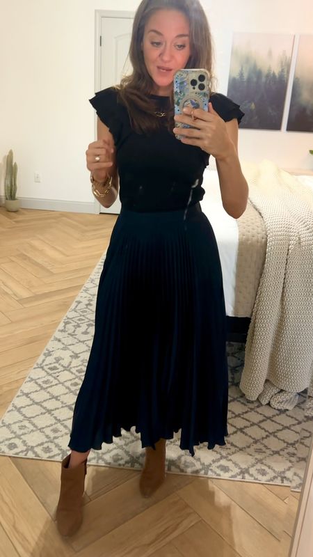 I love this navy satin midi pleated skirt from Abercrombie and Fitch! 

I’m 5’8”, usually wear a size 27 pant, and I’m wearing a small here. But, I probably should have gotten an XS. 

#LTKFindsUnder50 #LTKVideo #LTKStyleTip