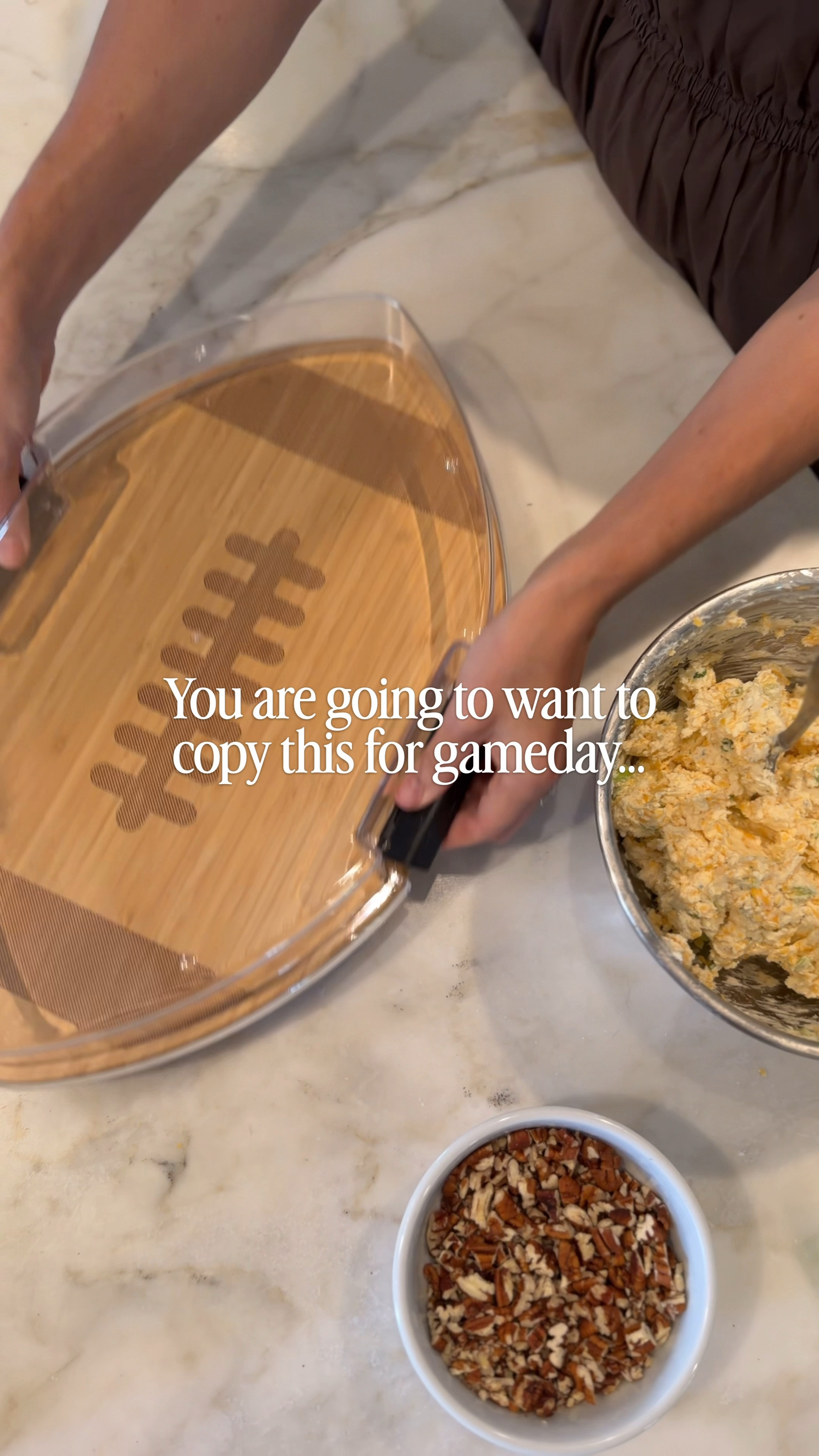 
Amazon Tailgate Must Have! Grab this portable football board! A homemade cheese ball is an easy tailgate snack that everyone will love! I mixed cream cheese with shredded cheddar, a ranch seasoning packet, chopped green onions then shaped it into a football, covered with chopped pecans, and piped stitching lines on top using softened cream cheese in a bag. Most recipes call for bacon bits as well and I will be mixing some in next time! I added different cracker options all around the board and snapped the lid on so it’s ready to go straight to the tailgate or watch party! 

#footballtailgate #amazontailgate #gamedaymusthave #footballparty #chacuterie #charcuterieboard #grabandgo #cheeseball #homefinds #homedeor #fallfashion #dress 

 #LTKmomlife #LTKSeasonal #LTKHome