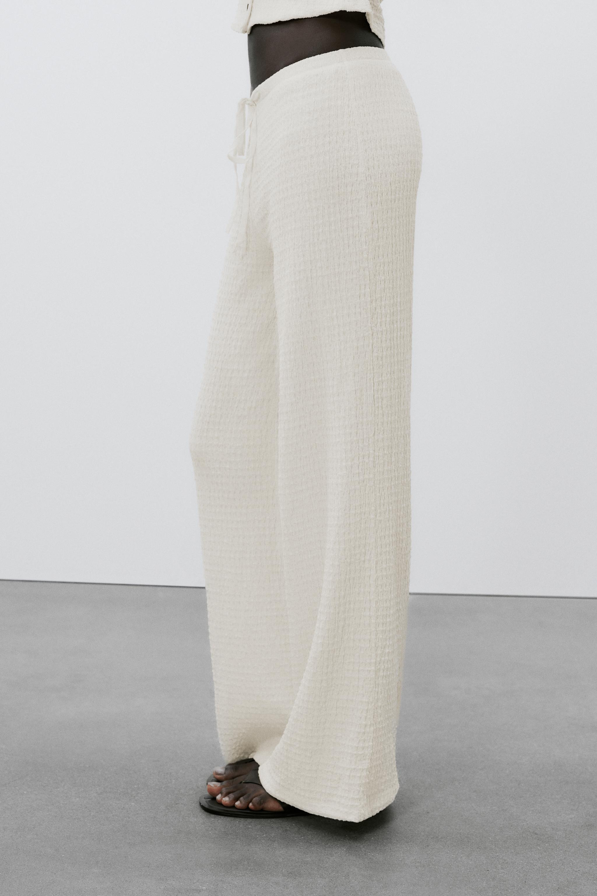 Pants made of structured fabric. High waist with adjustable elastic drawstring waistband. | Zara US