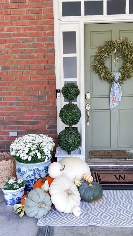 Fall front porch!! Planters, doormat, wreath, sash, topiaries, blue and white chinoiserie planter, and more linked here!

#LTKhome #LTKstyletip #LTKSeasonal