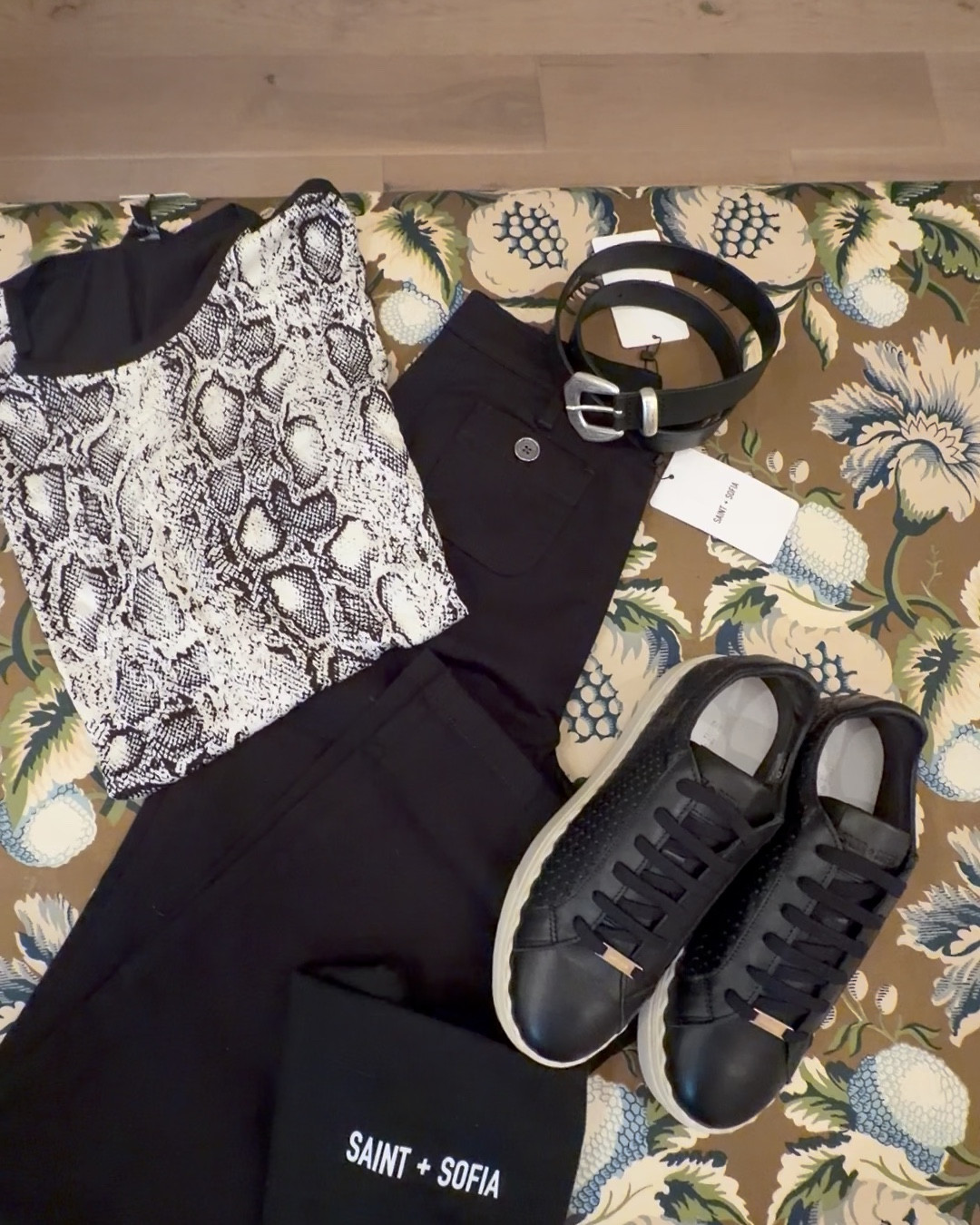 Turn up contrast tee in cream

A classic flared jean in jet black with some stretch for a stylish, vintage look. Perfect for work or weekends, these flared jeans have a flattering fit with a high waist and patch pocket detail. Each style is designed in Aint & Sofia London studios and hand made in Europe. Wear back with their Riviera Tee, Cambridge Blazer and heels for another night out look.
#ootd

Brook Scallop Sneaker - Black
Classic leather trainers with textured panels and a scallop trim
Black western style belt

#LTKWorkwear #LTKgrwm #LTKOver40