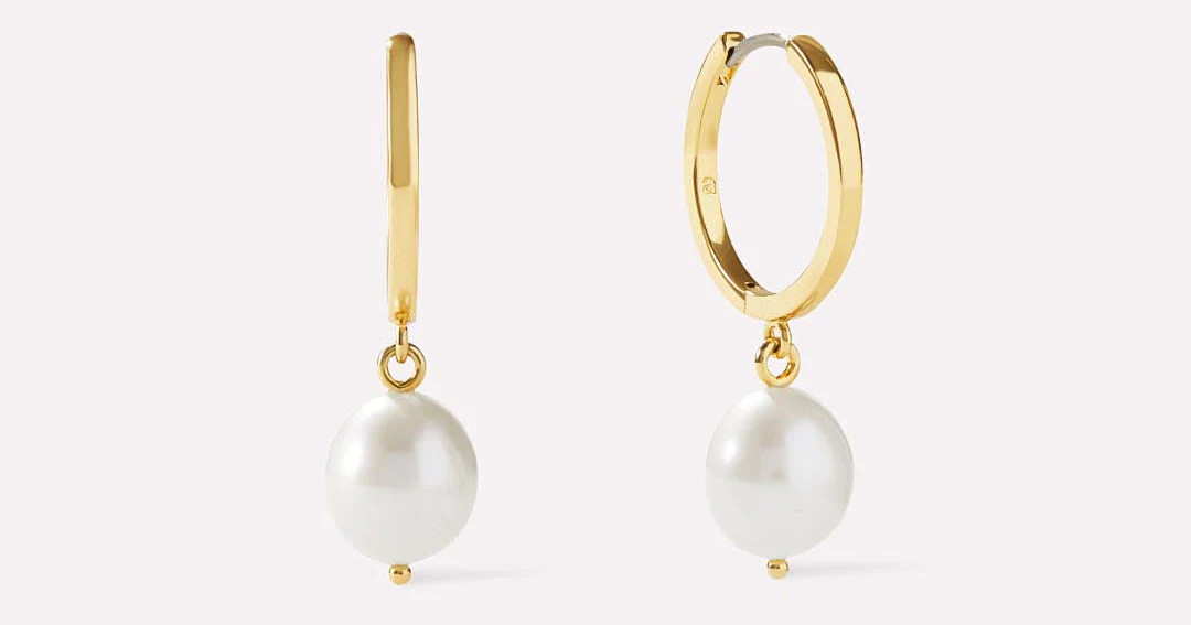 Meet our pearl hoops — a bigger, bolder version of our best-selling Frida earrings. Enhance you... | Ana Luisa