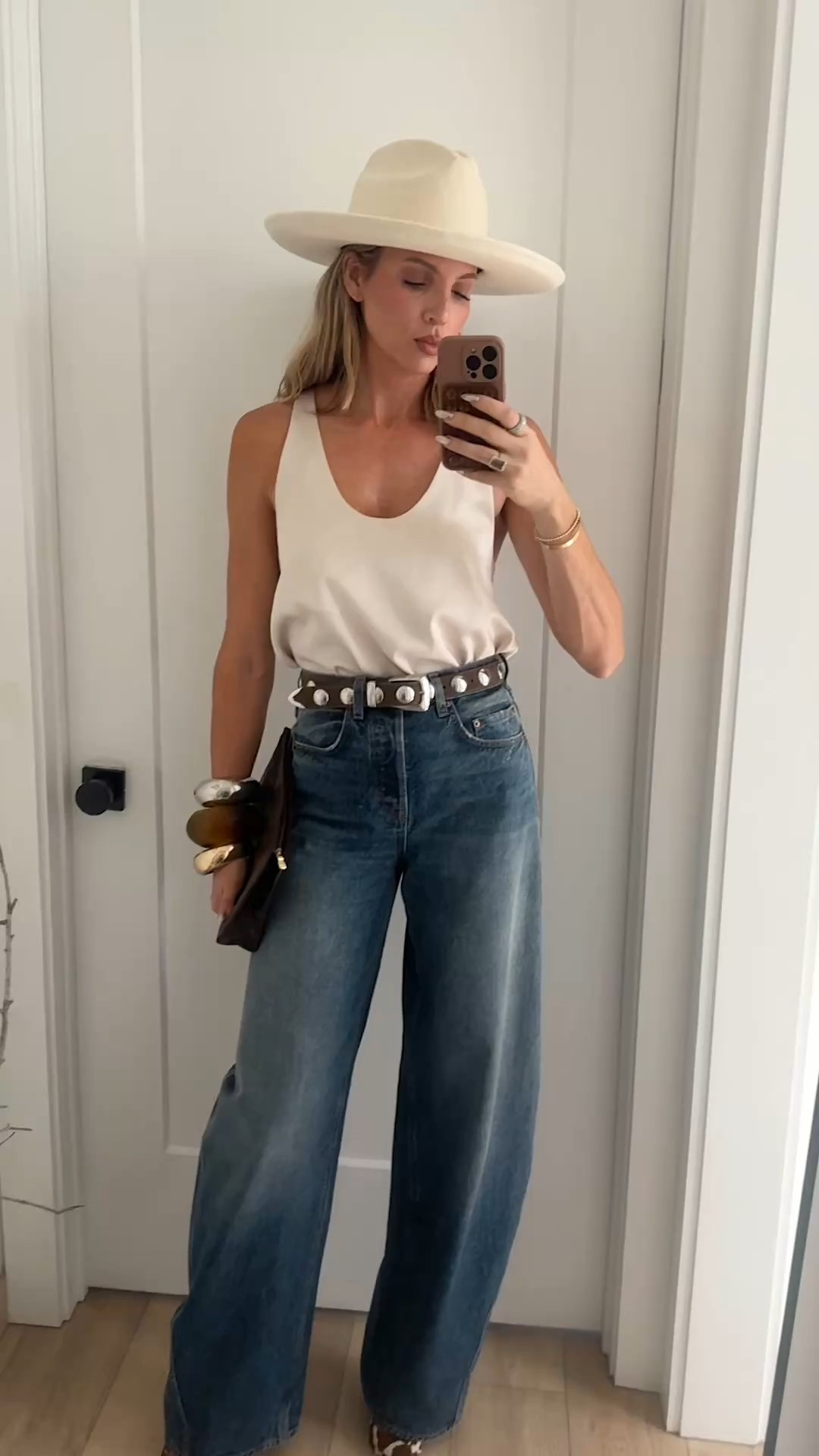 Top is old, but linked some similar tanks. The sizing on these pants is weird. Size down two sizes! Tall girls I am 5'10 and look how long they are on me! They also come in a shorter inseam as well. These cow print heels are so much fun! 🐄

#LTKStyleTip #LTKShoeCrush #LTKOver40