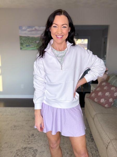 Lavender tennis skirt on sale for under $20! Love the high waist and flowy fit on the bottom. Looks great paired with a white pullover zip-up or a tee tucked in. 

Sizing:
Skirt runs a little small, I sized up to a M for length and comfort. 
White pullover fits TTS. I’m between an XS-S and I sized down to an XS in this. Same with the long sleeve tee.
Sneakers fit TTS. 

Casual outfit, activewear, athleisure wear, mom outfit, sale alert, affordable style 

#LTKfindsunder50 #LTKSeasonal #LTKsalealert