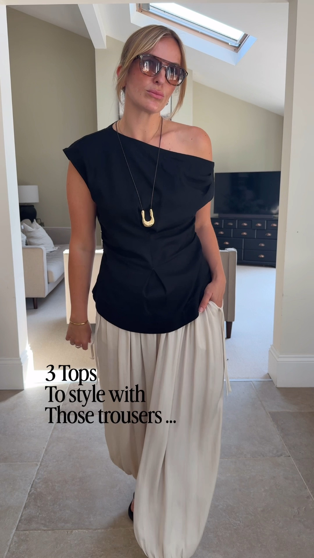 I featured these trousers in my holiday edit - a beautiful drapey balloon style in a luxe neutral shade . Currently on sale. They come up generous ( I’m wearing a U.K. 12 - usually a 14) 
For something a little more elevated I’ve chosen some asymmetric tops and a regular shirt styled a touch more feminine. 

Adding a statement earring , necklace, bag or footwear to push them into dressier territory 

Sizing 
Black top - U.K. 14 
Black shirt - medium
White T - U.K.14
The bra I tend to size up once in the back measure and then down once in the cup to compensate

#LTKsummer #LTKtravel #LTKdatenight