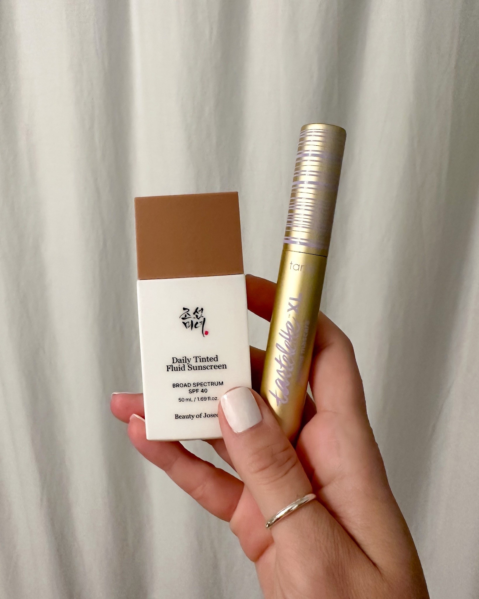 My 2 minute makeup routine to run out of the house without looking like a zombie. 

The Tartelette XL Tubing Mascara is my ABSOLUTE FAVORITE! Plus, it comes off so easily when washing your face. 

Daily Tinted Fluid Sunscreen shade: MP200

* SPF 40 to guard against UVA/UVB

* Lightweight and Moisturizing: Provides hydration without white cast; gentle and won't sting eyes, ideal for daily use.

* Perfect Finish: Daily Tinted Fluid Sunscreen blends seamlessly so your skin still looks like skin—but better. The smart formula controls excess oil without drying your skin out, which allows your base to last longer and stay fresh throughout the day
#LTKHalloween #LTKFallSale 

#LTKParties #LTKSeasonal #LTKSaleAlert #LTKTall #LTKSwim #LTKActive #LTKBaby #LTKU #LTKBump #LTKTravel #LTKMens #LTKFindsUnder100 #LTKOver40 #LTKHoliday #LTKPetite #LTKBeauty #LTKFindsUnder50 #LTKHome #LTKWedding #LTKMidsize #LTKFamily #LTKStyleTip #LTKKids #LTKShoeCrush #LTKWorkwear #LTKGiftGuide #LTKItBag