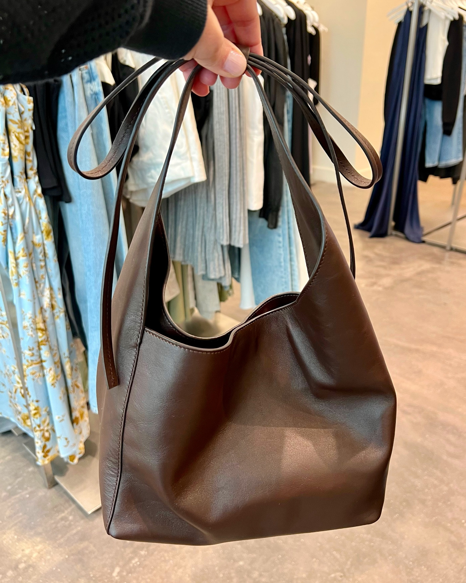 Simple but chic chocolate brown shoulder bag with bow detailing on the top from Reformation. This bag comes in a small size (shown above) and a medium sized linked below.

#LTKitbag #LTKstyletip #LTKover40