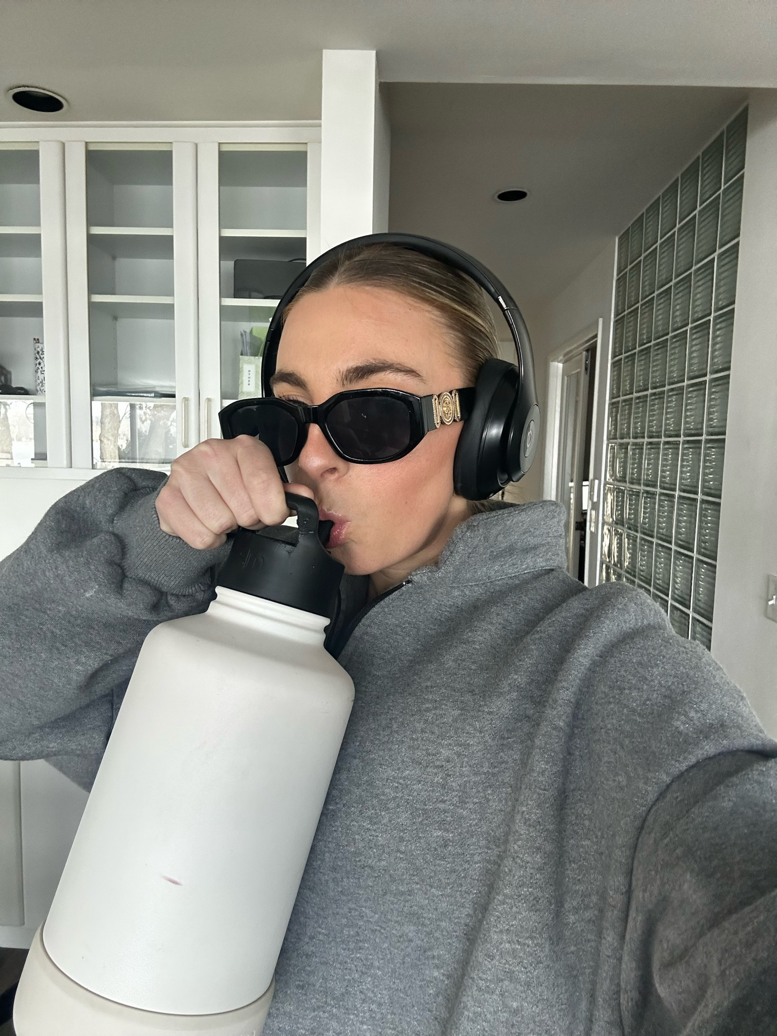 Hot girl walk style, slicked hair, slick back bun, headphones style, Beats Studio, large water bottle, emotional support water bottle, simple modern water bottle, Versace dupe sunglasses, Amazon sunglasses, oversized quarter zip, Amazon quarter zip 

#LTKbeauty #LTKfit #LTKstyletip