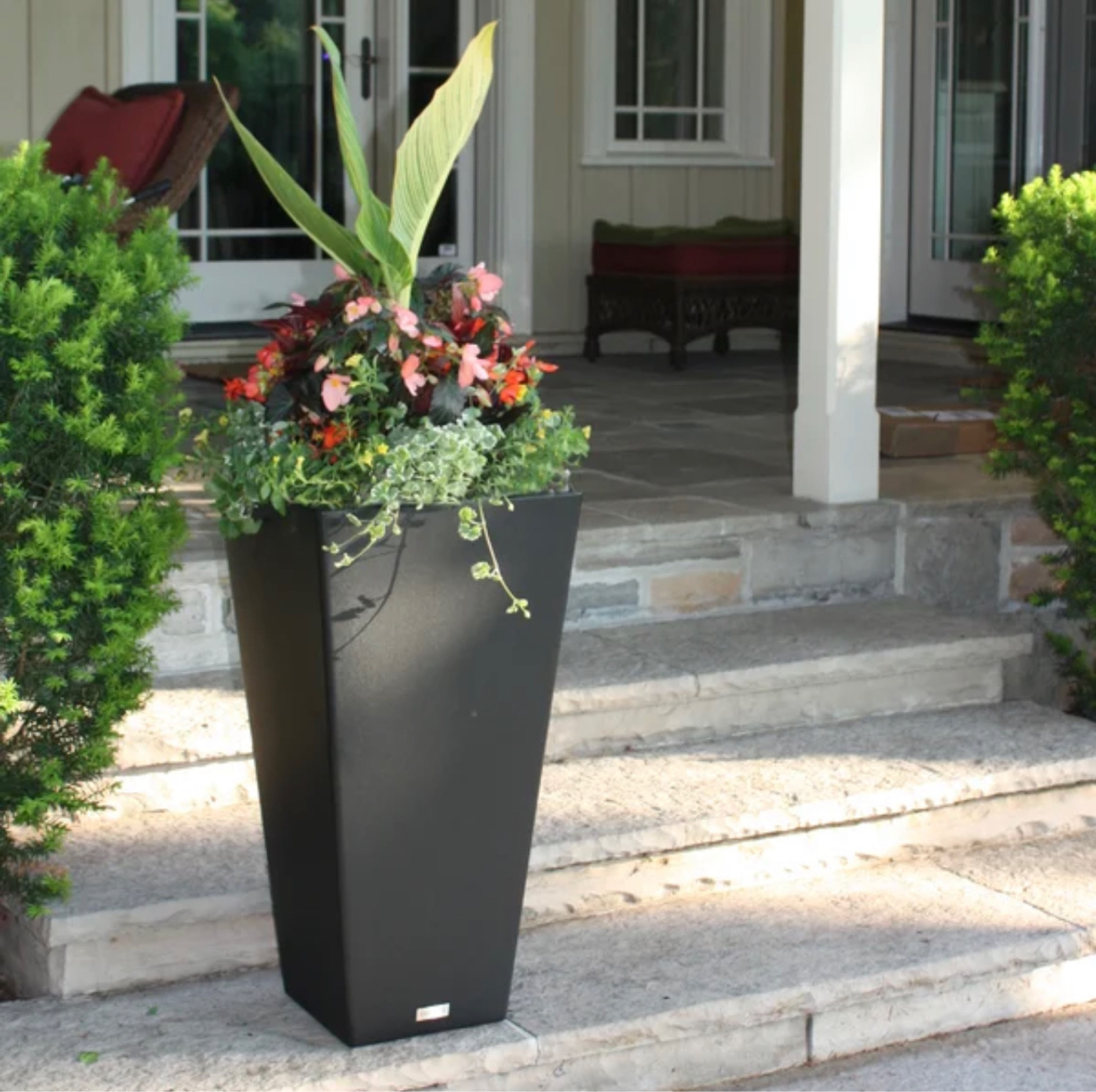 Our front porch garden planters that hold faux boxwood balls. They have a removable inner shelf to raise plants and lots of drainage space. My favorite planters!! #gardening #porchdecor #planters #frontporch #backyardplanters #moderndecor #ltkhome

#LTKSeasonal #LTKFind