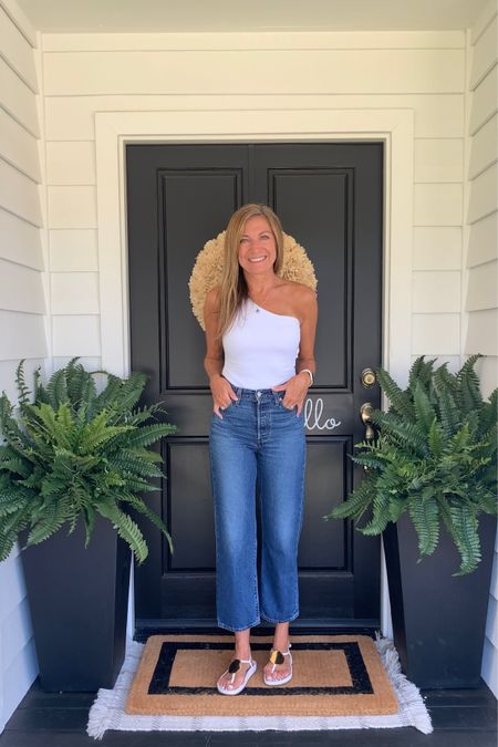 LOVE these faux ferns with my porch planters, doormat, neutral wreath and hello sign. All so easy peasy for an instant porch refresh. My tank and jeans are linked here too!

#LTKstyletip #LTKhome #LTKSeasonal