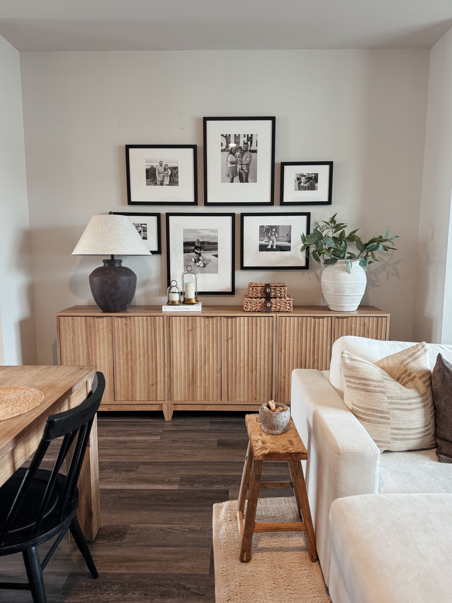 Cozy, neutral living space with all the textures I love 🤍
Layered wood tones, a warm table lamp, woven accents, and a simple black + white gallery wall to keep it personal and timeless.

Shop this space on my LTK ✨
neutral home decor • organic home style • wood sideboard cabinet • gallery wall frames • black frame gallery wall • neutral living room • cozy home ideas • woven decor accents • table lamp styling • family photo wall • warm minimal home • affordable home decor finds

#LTKSaleAlert #LTKHome