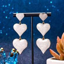 1 paar modieuze overdreven gouden witte hartvormige oorbellen voor dames | SHEIN