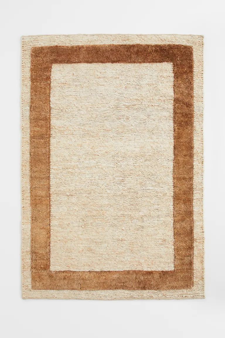 Large rug in braided jute with a contrasting colour border. | H&M (UK, MY, IN, SG, PH, TW, HK)
