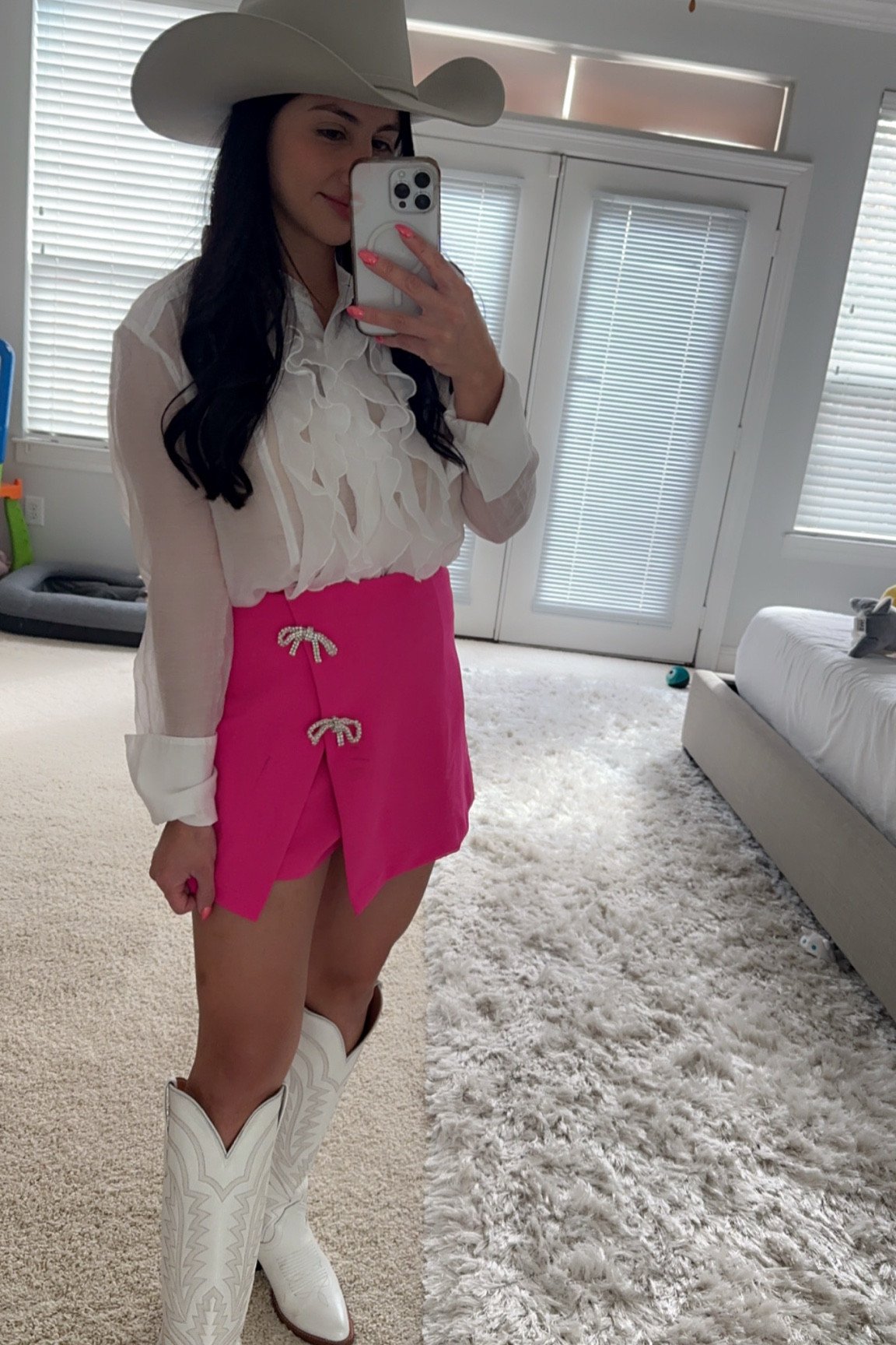 Pink skirt with boots 

#LTKStyleTip
