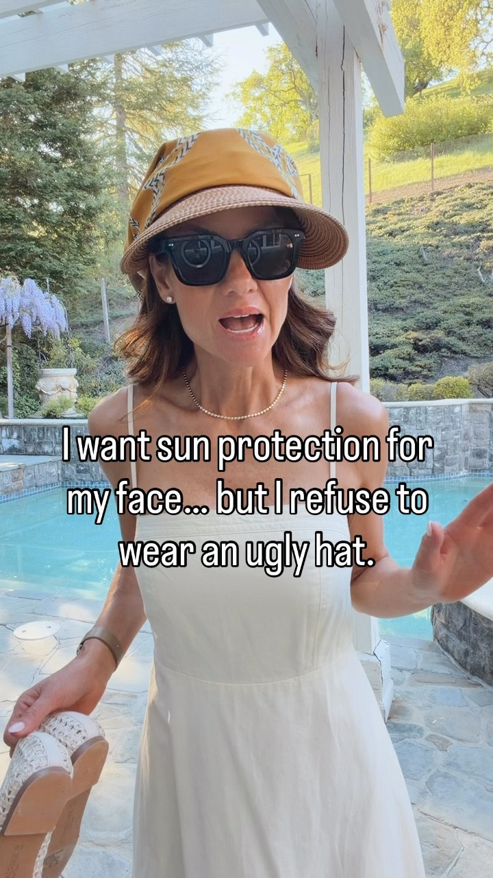 Let’s be honest… most sun hats aren’t it. They’re either bulky, not flattering, or just feel frumpy. This @ericjavits hat with the attached scarf solves that: ✔️ Actually protects your face ✔️ Lightweight + comfortable ✔️ Instantly makes your outfit feel styled  Wearing it 3 ways here: – Jumpsuit (easy everyday) – Black dress for lunch – White dress + woven ballet flats (my favorite 🤍) Sometimes it’s just one piece that pulls everything together. #ericjavits #ad
Use code LESLIE10 for 10% off sitewide  
 

#LTKSeasonal #LTKootd #LTKTravel