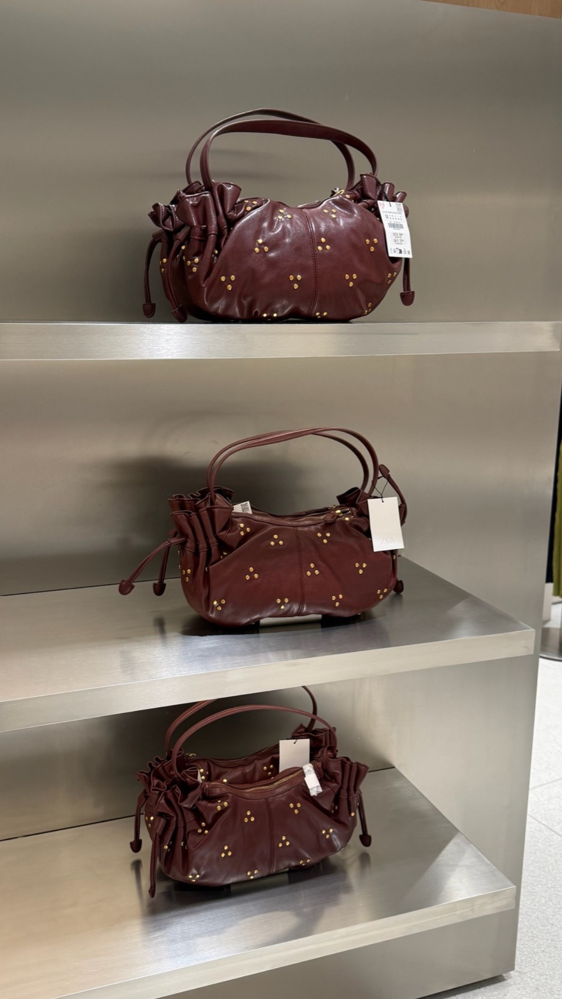 Wine colored shoulder handbag with gold embellishments. Fall statement bag

#LTKootd