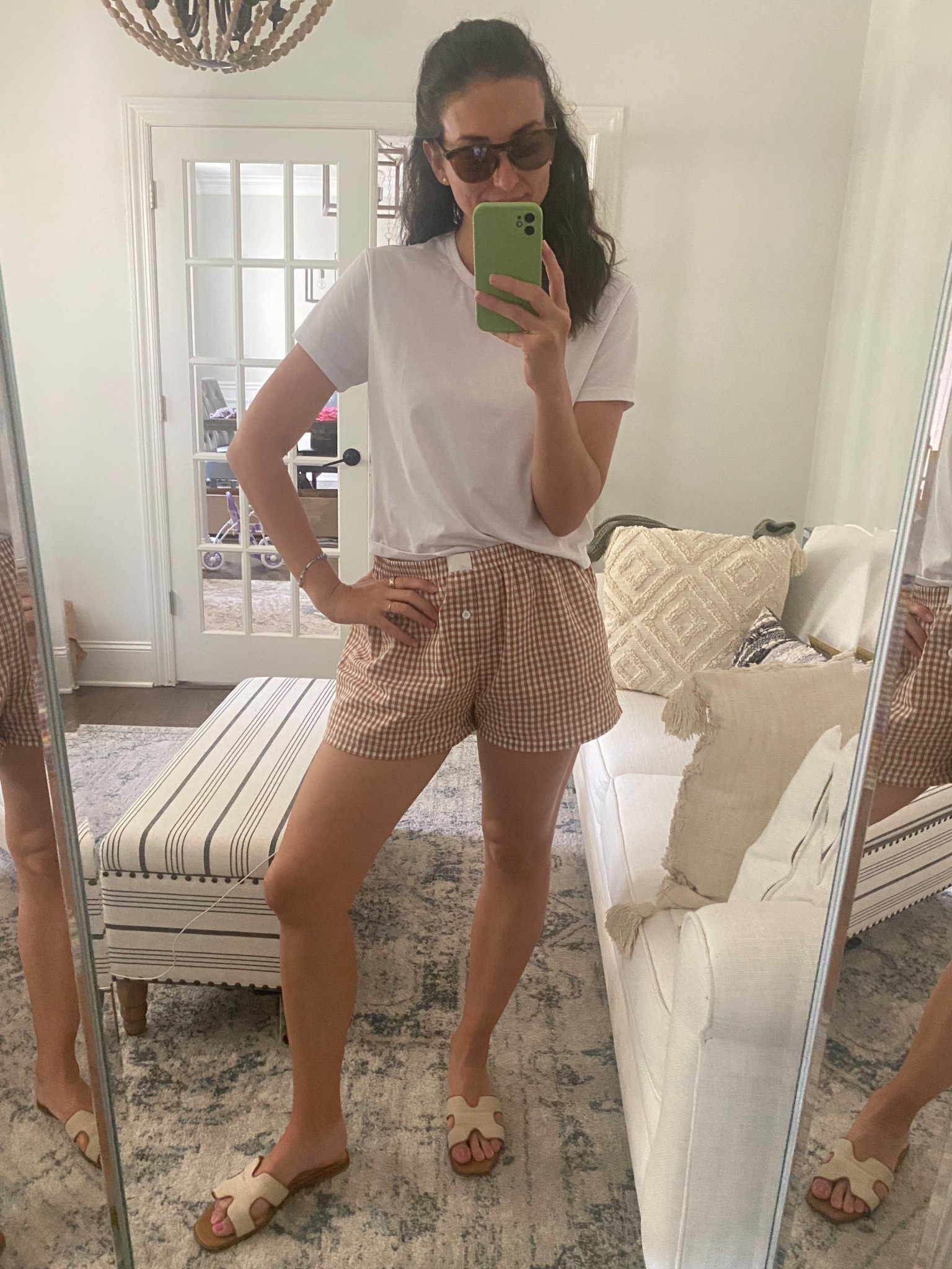Today’s super casual work from home outfit. I just got these neutral slides from target and I love them! They go with everything. I’m wearing a size 10 in the sandals and they fit true to size. This boxy white cuts tee has been a staple for me for the last few years, great relaxed fit! I’m wearing a small and the fit is perfect. These boxer shorts I got last year and I love for when I want something easy. The neutral gingham is perfect for lounging or running errands. I sized up to a large for a loser fit. Finally these are my new go to tortoise sunglasses. I love the colors and style! My white tshirt and shorts are on sale! 

#LTKFindsUnder100 #LTKFindsUnder50 #LTKSaleAlert