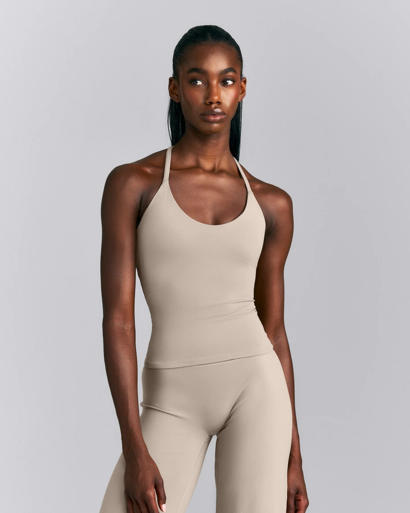 SoftMotion™ Strappy Halter Neck Tank Top with Built in Bra Shelf New Branding
Warm Sand | Oner Active (UK / US)