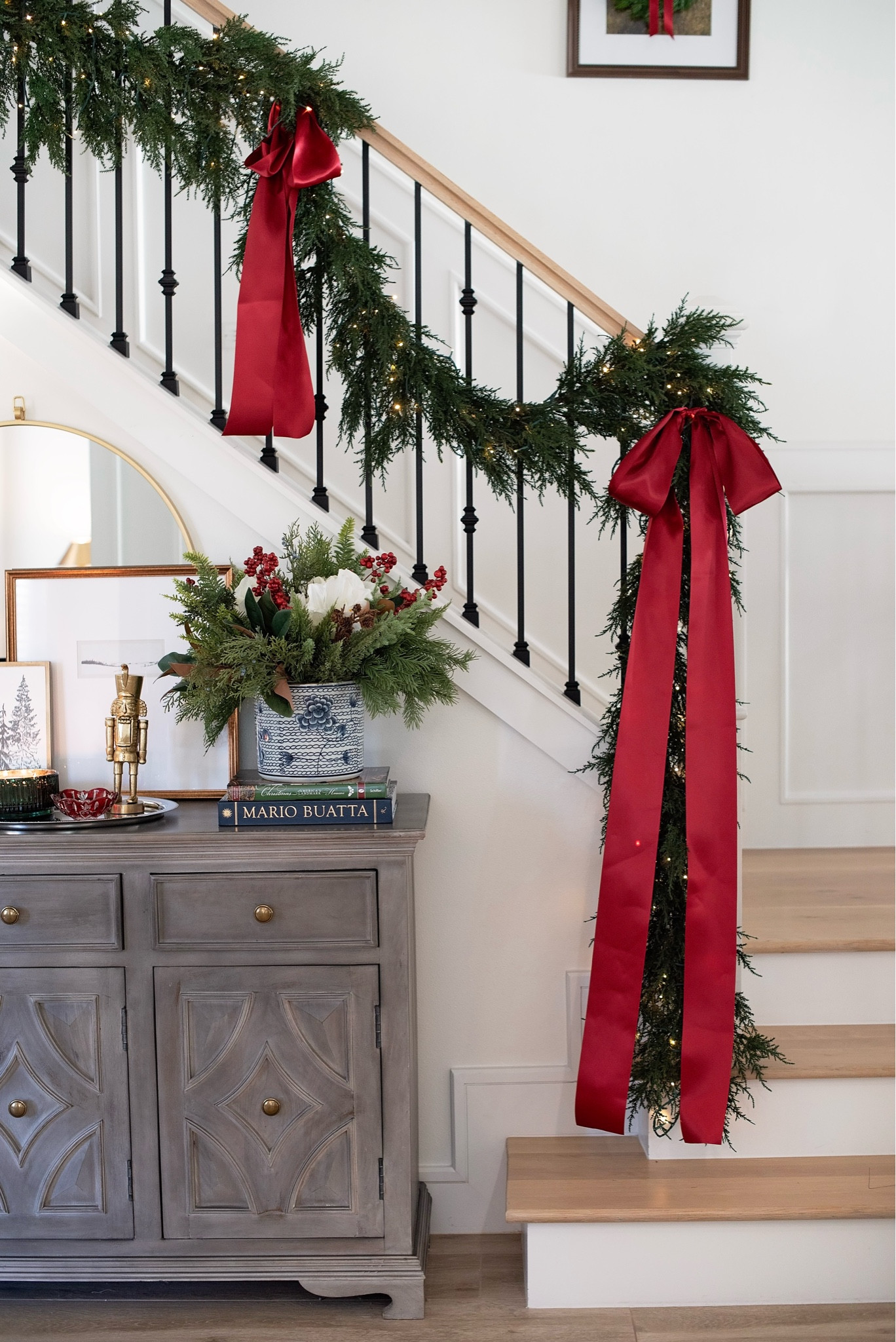 Entry way table and stair case decorated for Christmass

#LTKHoliday #LTKSeasonal #LTKhome
