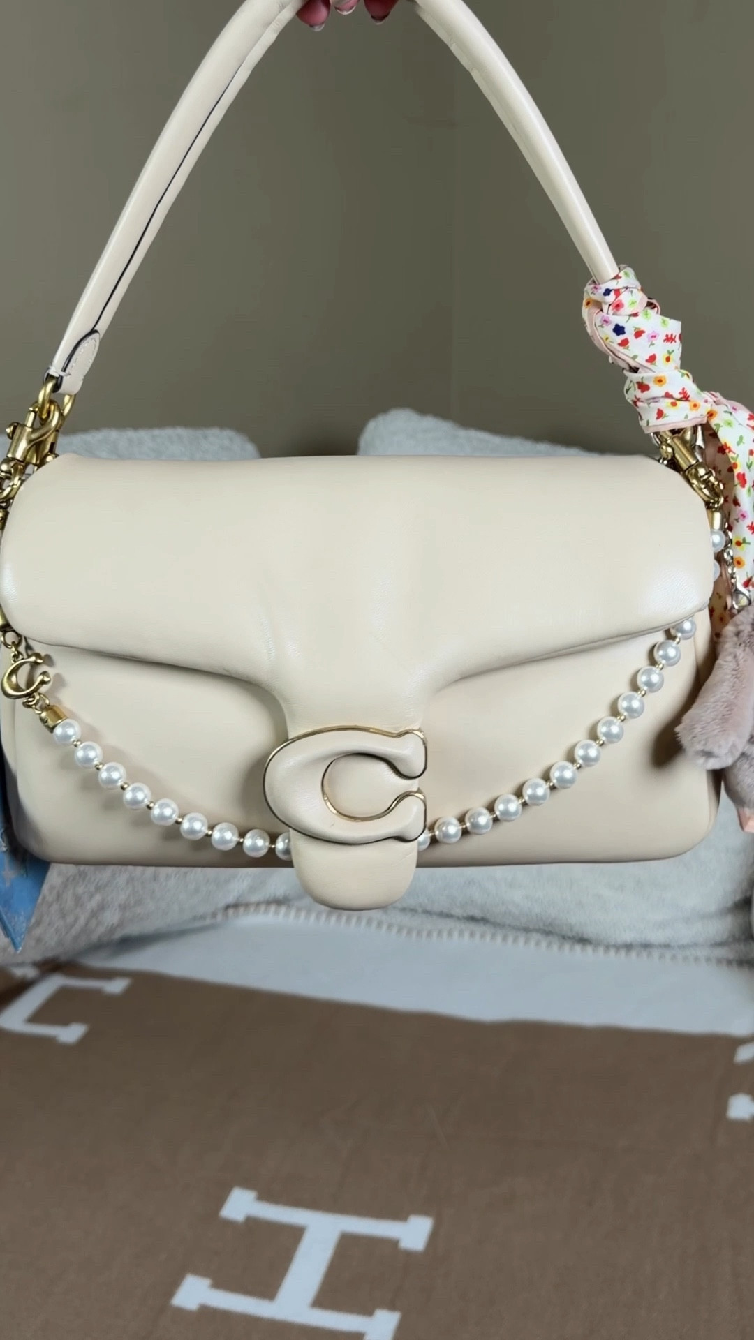 What fits in the Coach pillow tabby 26🤍

The Coach tabby was my 2nd Coach bag I got years ago and I still love how soft and squishy she is. Like a giant marshmallow 🤍

She can fit a book, facial spray, wallet, Chanel lip gloss, hempz hand lotion, touch land sanitizer

And then I styled her with some spent accessories tha are perfect for Easter 🐰 with this adorable little gray bunny charm, pride and prejudice book chem, and a pearl chain from the Coach outlet and floral Twilly 

Rabbit bag charm
Floral scarf 

#LTKSeasonal #LTKSpringSale