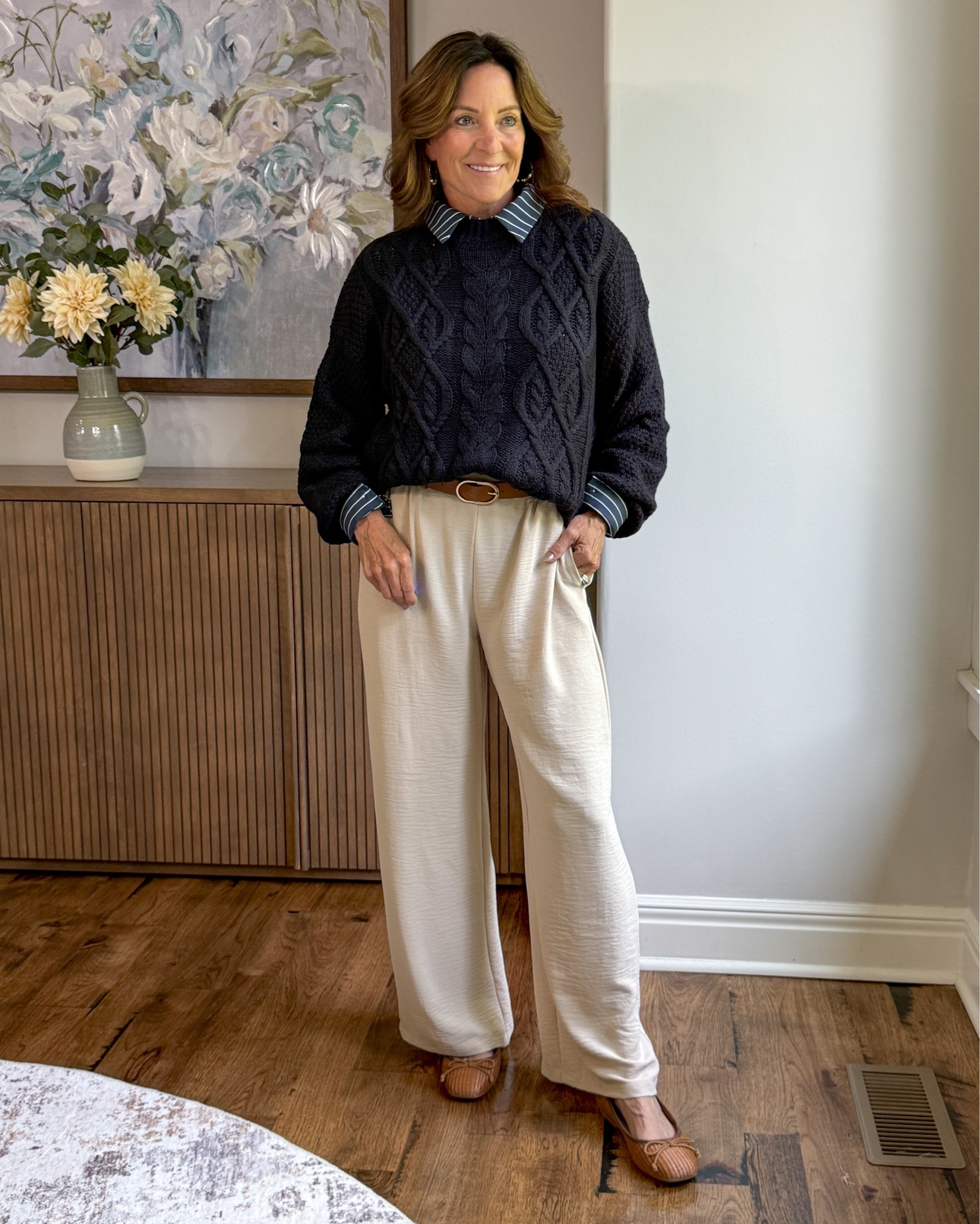 The Little Details Make the Outfit

Navy and cream is always a classic, but it’s the striped collar, belted waist and textured cable-knit sweater that make this outfit feel special. Comfortable wide-leg pants and flats keep it easy enough for everyday while still looking pulled together.

#over50style #blackandcream #widelegpants #classicstyle #outfitinspiration