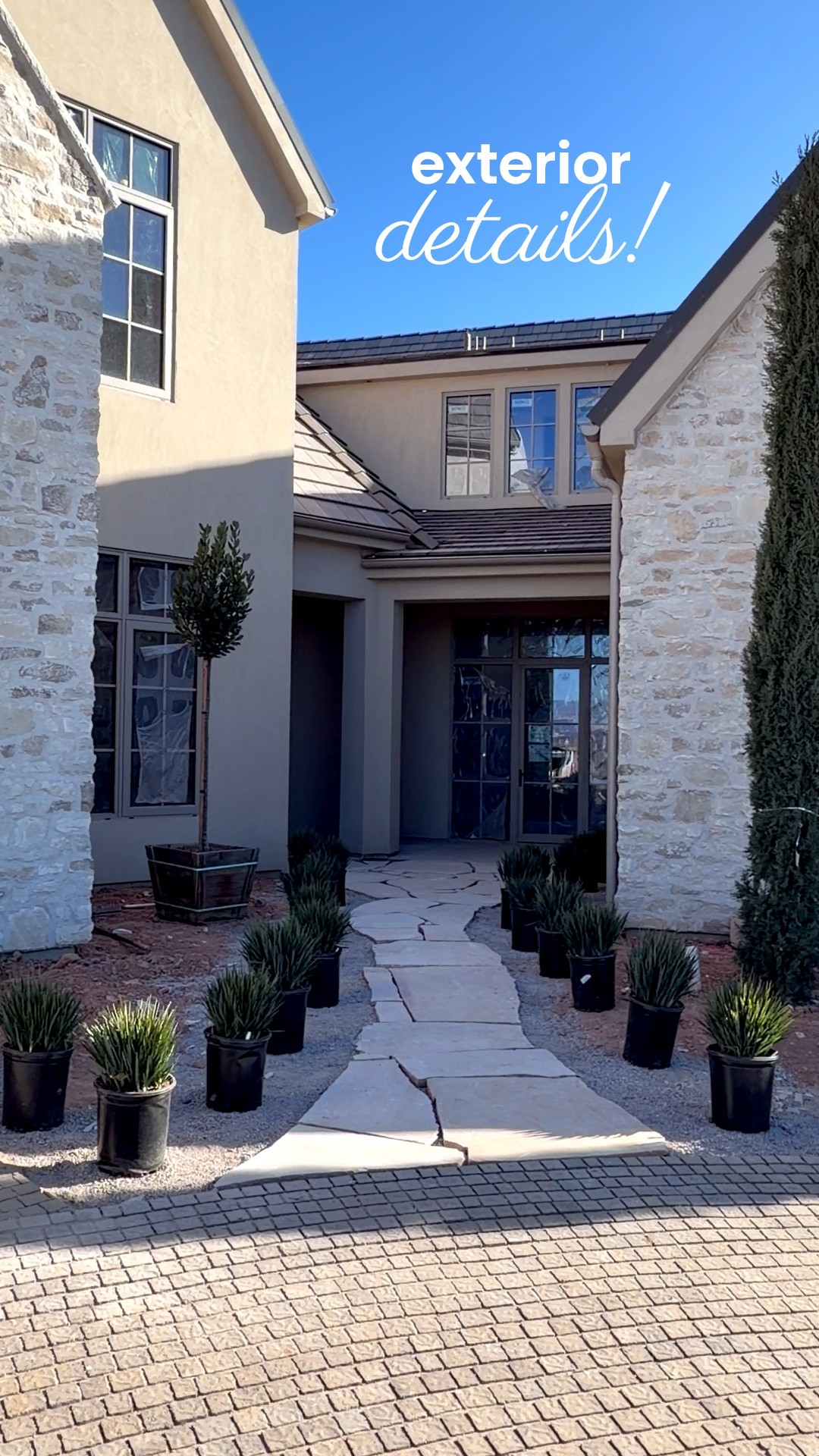 Kinda obsessed! I wanted a flagstone pathway to help distinguish the mudroom door from the front entry. Also got to design these cool custom 40” outdoor lights. Hoping to make them available soon! There’s a smaller version I’ll link that we used over by the garage doors. 2 more weeks til this home is open for the public to come tour!! 

Stone: Milan Ridgestone from Harristone

#LTKdayinmylife #LTKSaleAlert #LTKHome