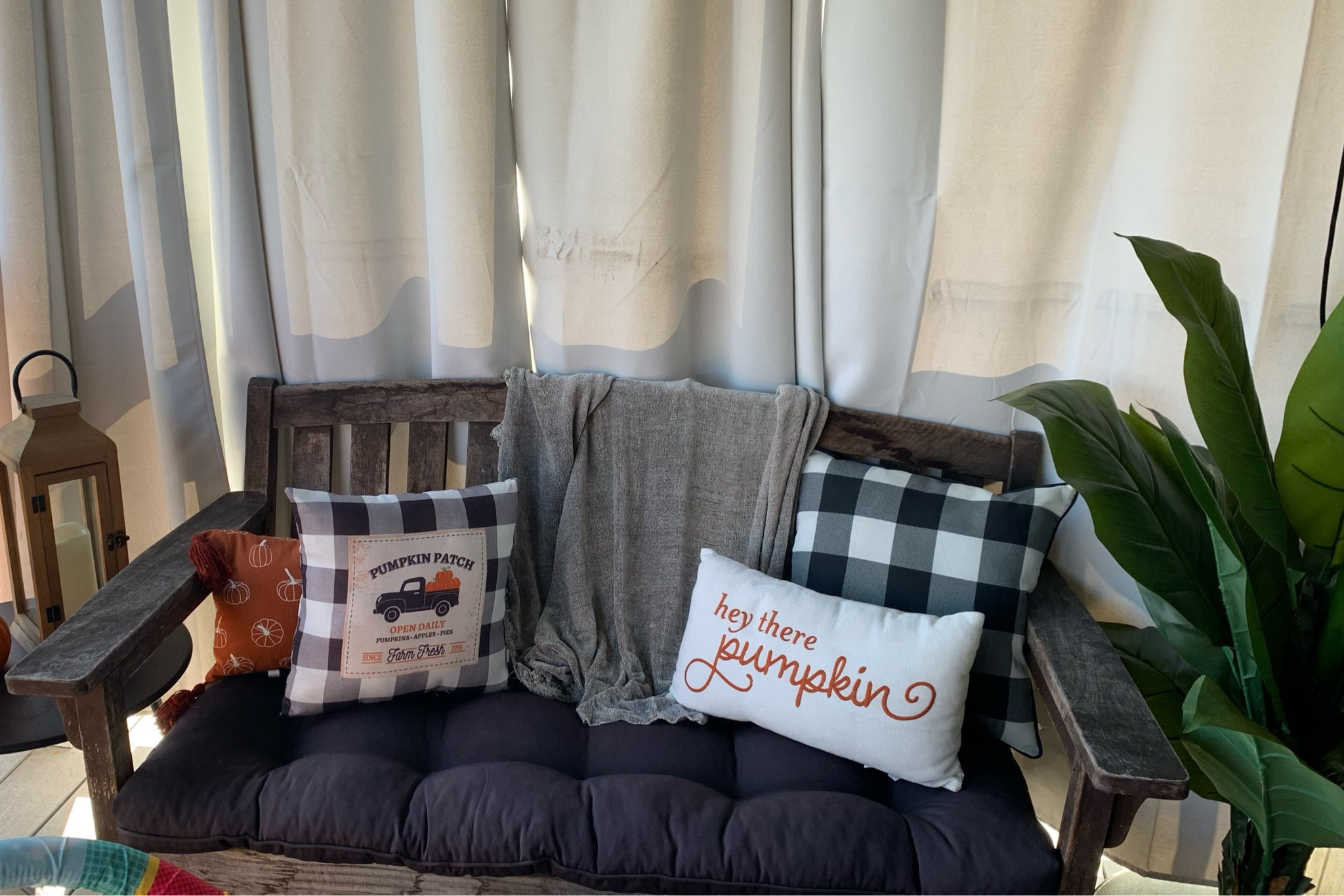 Fall porch. Pumpkin topiary. Black porch lanterns. Faux Porch plants. Porch decor ideas. Halloween porch. Farmhouse porch. Fall patio. Farmhouse decor. Halloween home. #porchlanterns #falldecor #fallhome #fallporch #porchdecor
