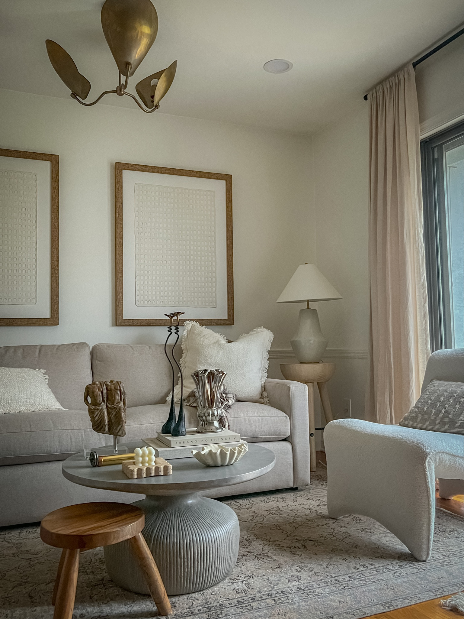 Living room decor, living room styling, living room wabi sabi decor, round coffee table, chrome vase, silver vase, iron candlesticks

#LTKfindsunder100 #LTKsalealert #LTKhome