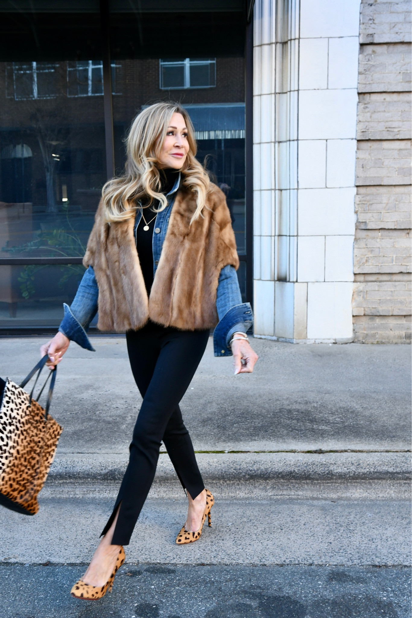 Wearing a vintage fur stole with fabulous legging pants from Theory (love the slit), leopard pumps and tote, a black turtleneck and an oversized denim jacket.  

#LTKshoecrush #LTKitbag #LTKstyletip