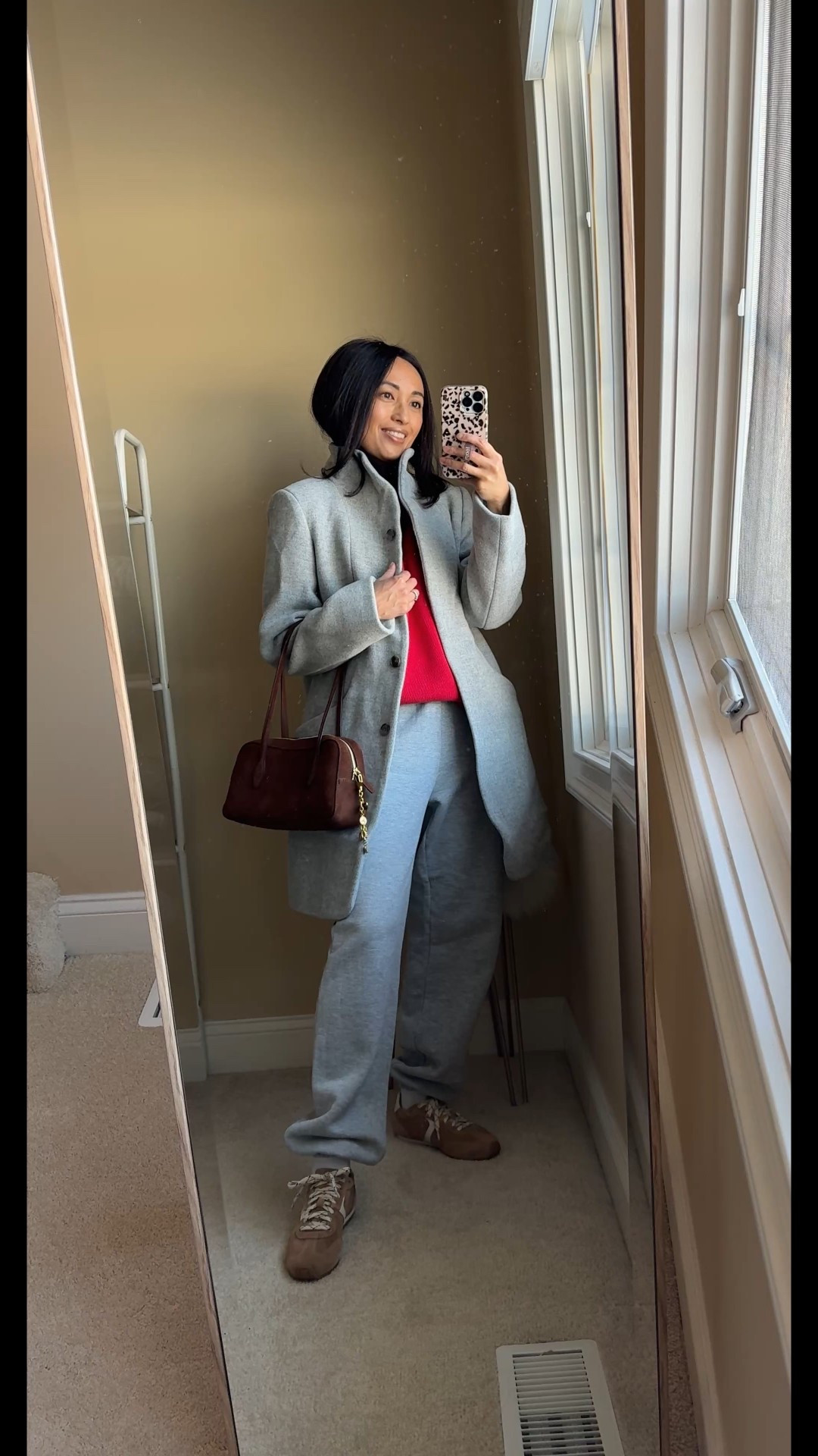 Winter outfit. 
Re-styling my everyday winter uniform. 
- Sweat sets are my go-to when the cold gets even colder. 
- To change it up, swap your sweatshirt out for a comfy sweater, with a white t-shirt peeling out. A pop of color changes everything too. 
- Switch out your everyday athletic shoes for more fashion sneakers in a different color. 
- Trading your trusty long black puffer for a wool coat may feel like a stretch, but instantly elevates basic sweats. 
- Add a last bit of interest with a non-athleisure feeling bag and a bag charm. 


#LTKootd #LTKOver40