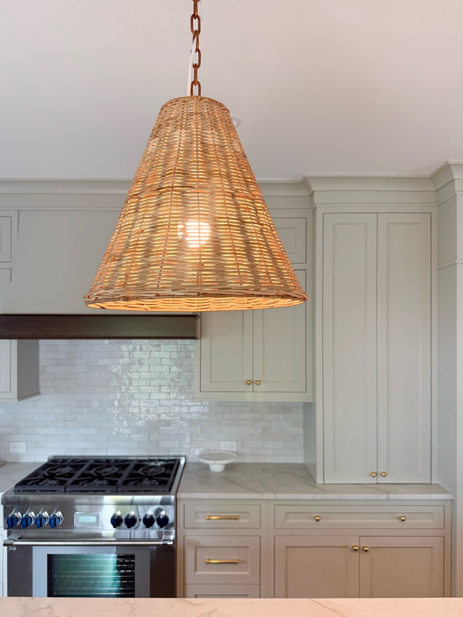 Lighting is one of my favorite ways to add warmth and texture to a kitchen, and this woven pendant does both beautifully. I love the natural material against the cabinetry and brass details.

woven pendant light, rattan pendant light, kitchen lighting, statement lighting, kitchen pendant, woven lighting, natural home decor, kitchen design, warm neutral decor, textured lighting, interior styling, girlonthehudson

#LTKHome #LTKdayinmylife #LTKTravel
