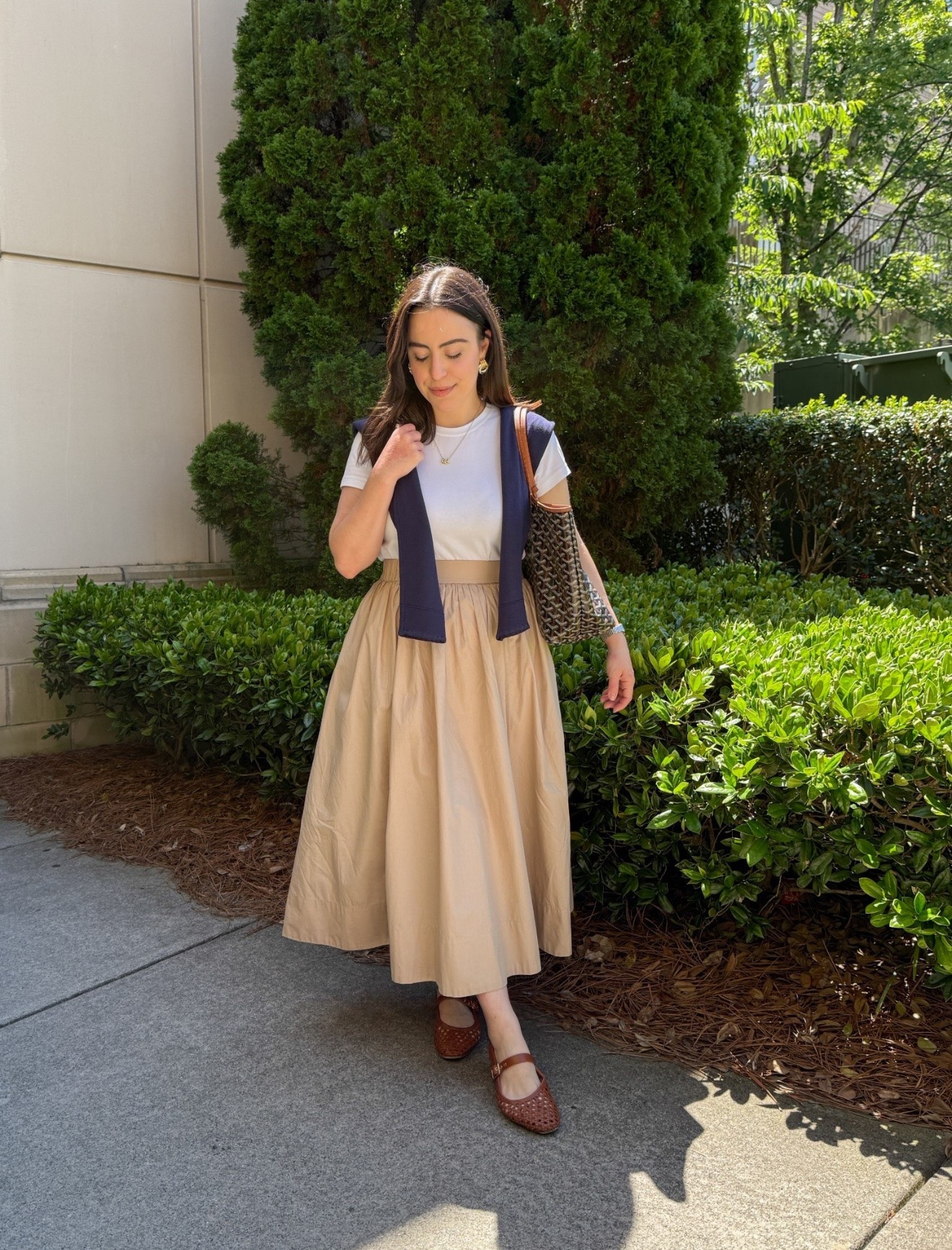 The ultimate classic outfit formula to wear on repeat! A chic khaki midi skirt paired with a high-quality white tee and woven flats creates a polished, everyday look you'll constantly reach for.

classic style, everyday outfit, khaki midi skirt, capsule wardrobe, petite fashion, neutral style, spring style

#LTKSeasonal #LTKU #LTKootd