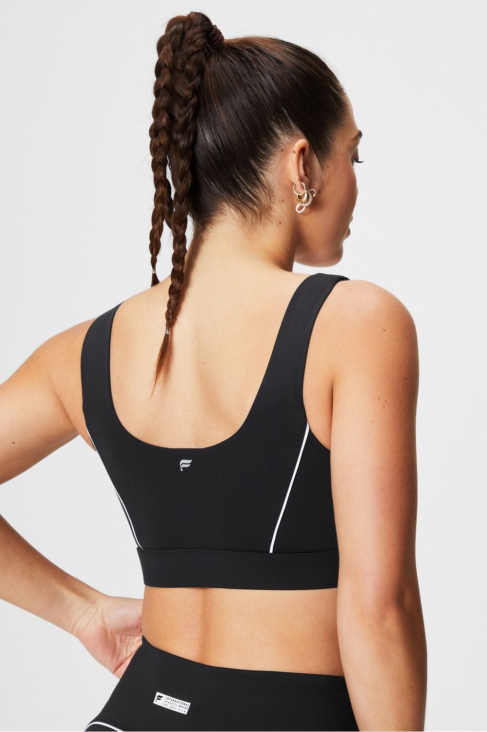 Medium Impact Piped Sports Bra | Fabletics - North America