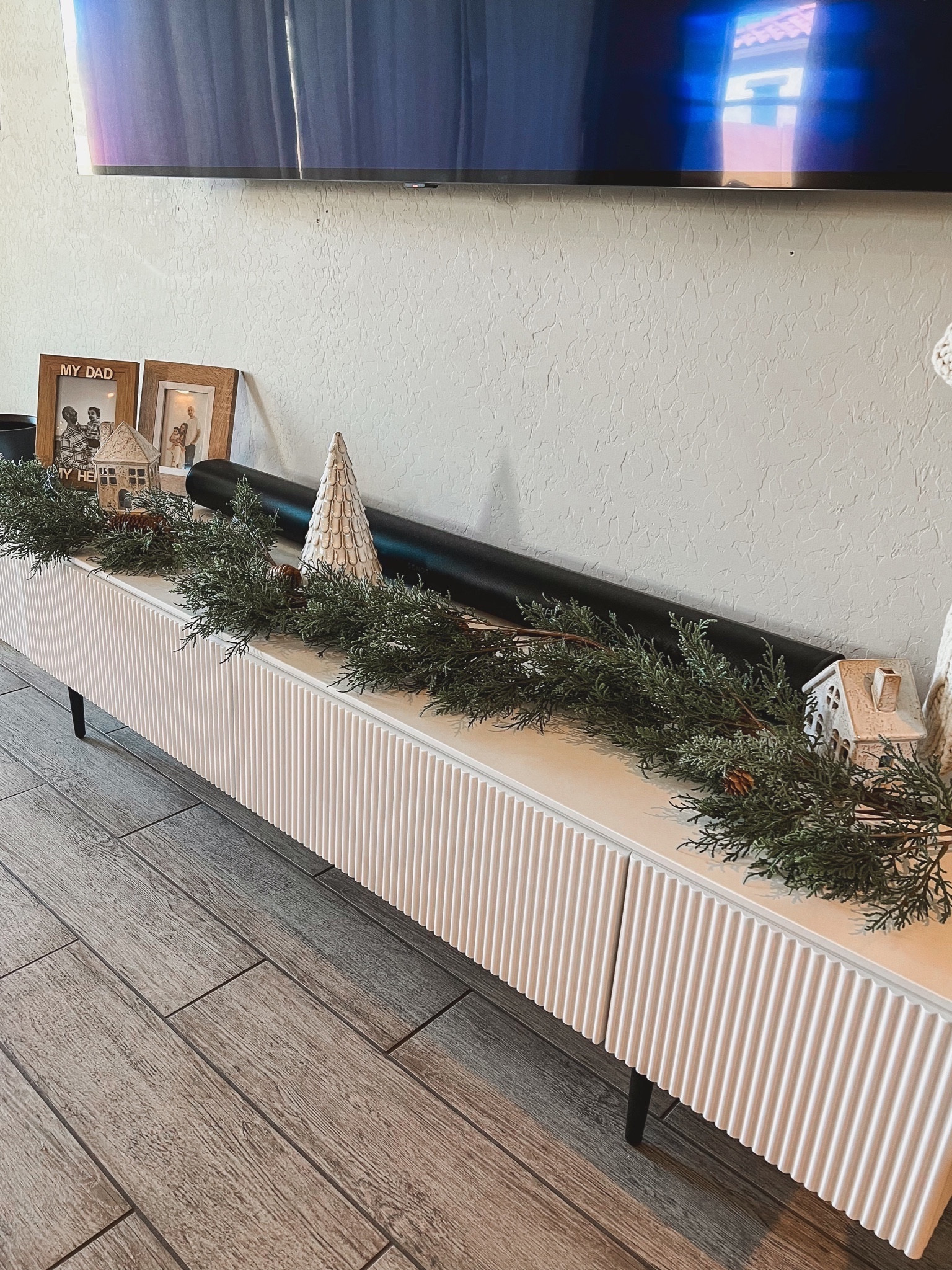 living room decor!🎄 

#livingroomchristmasdecor #livingroom #home #christmasdecor #holidaydecor #seasonal #garland #christmasgarland #hearthandhand #magnoliachristmasgarland #pineconegarland #frames #ceramichousevillage #wondershop #targethome #targetsale #targetsalefinds #targetdeals #targetfinds #targetmagnolia #homary #homaryconsole #tvconsole #whitetvconsole #whiteconsole #consoletable #targetframes #decorinspo #decorideas #decorationideas #christmasdecorations Sale

#LTKHoliday #LTKHolidaySale

#LTKSeasonal