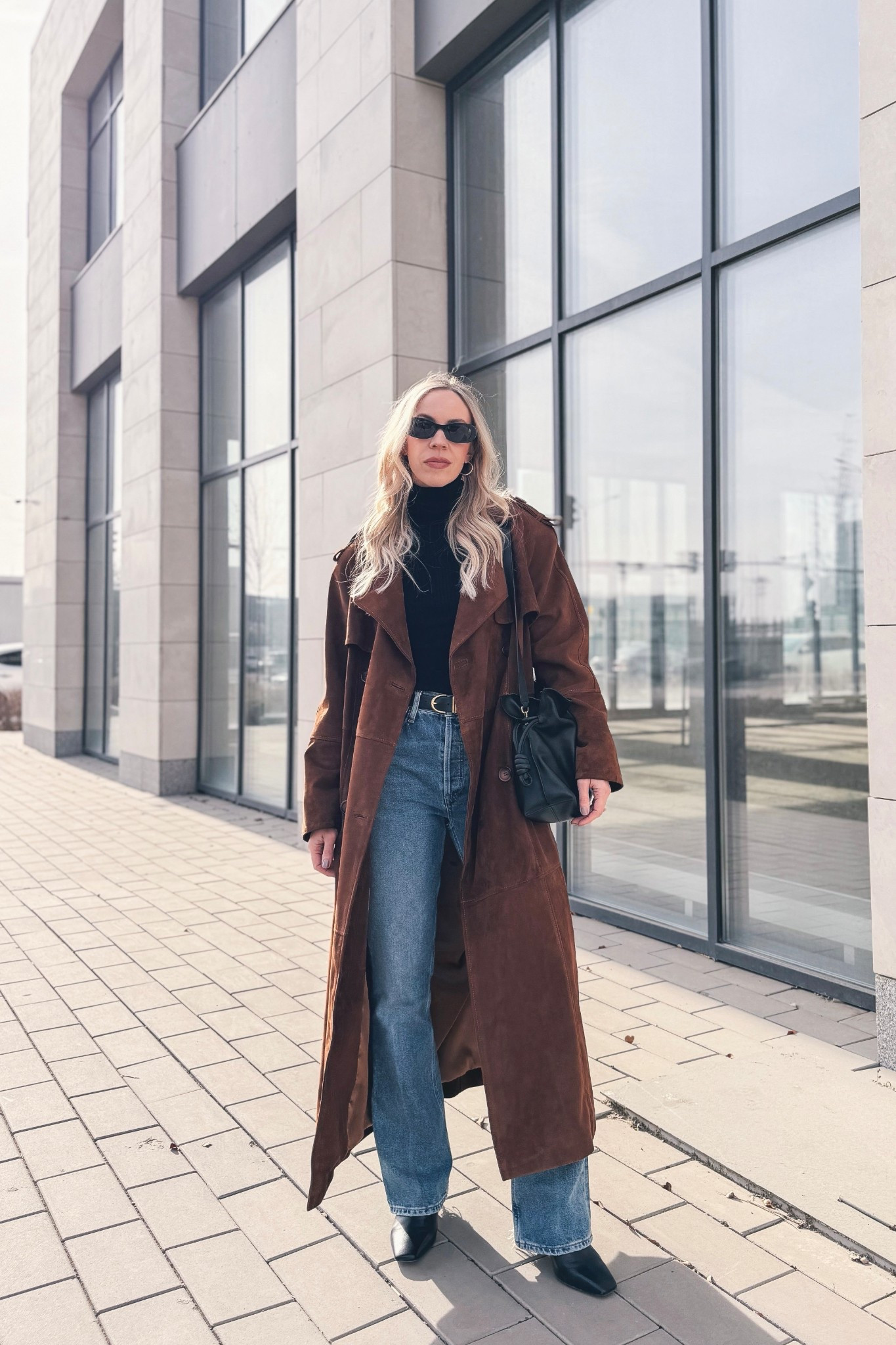 Spring outfit, suede trench coat, bootcut jeans, suede coat, Loewe Flamenco pouch handbag, CBK style, minimal style 

#LTKOver40 #LTKSaleAlert #LTKSeasonal