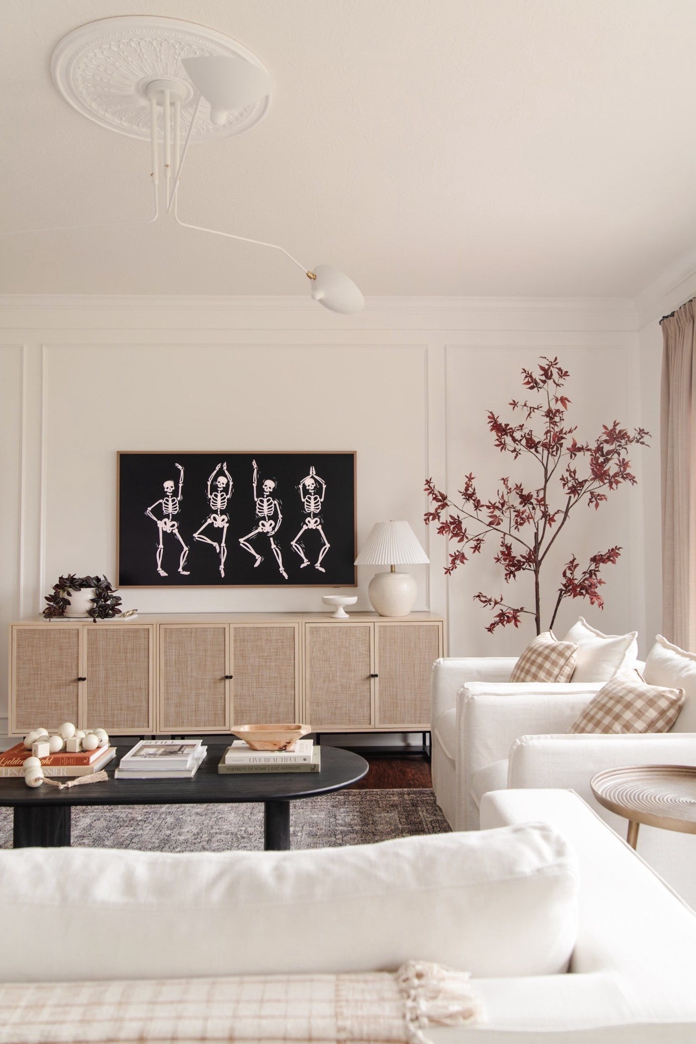 Fall living room decor, spooky skeleton tv art, classy halloween decorations, faux maple tree

#LTKHome #LTKSeasonal #LTKSaleAlert