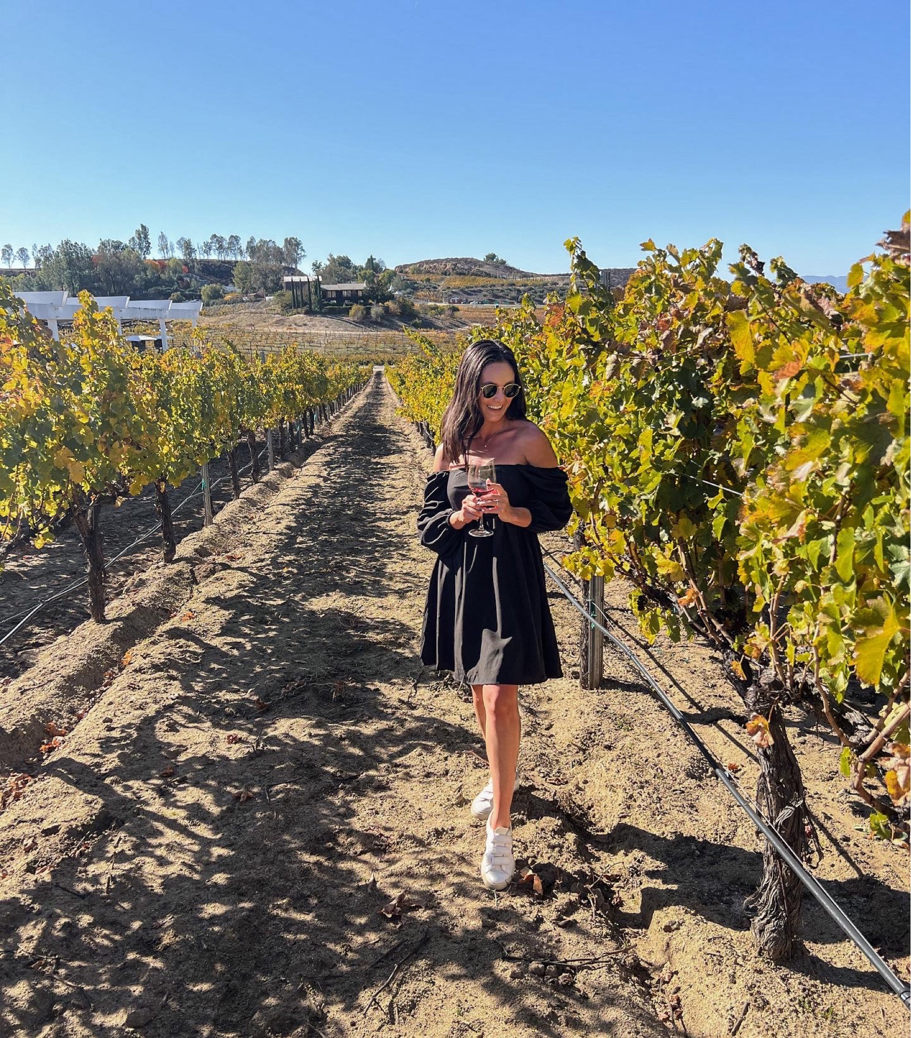 Black dress with sleeves. Short dress. Puff sleeves. White sneakers. Veja Velcro sneakers. Fall style. Spring style. San Diego trip. Wine tasting. Loose fitted dress. 
Amazon dress. 

Wearing a S

#LTKunder100 #LTKtravel #LTKunder50