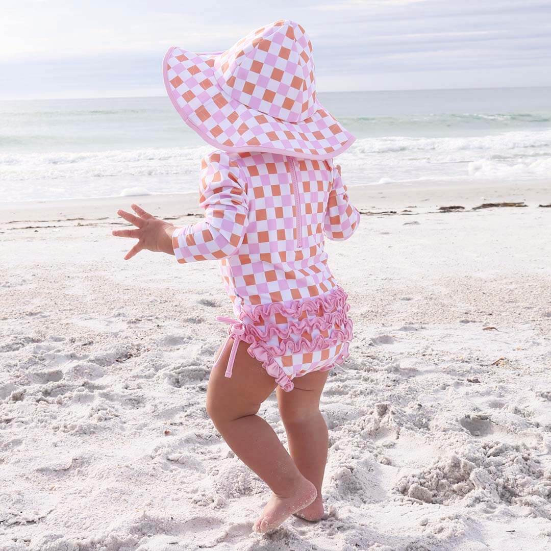 Long Sleeve Rash Guard With Ruffle Bottom | Check Me Out | Caden Lane