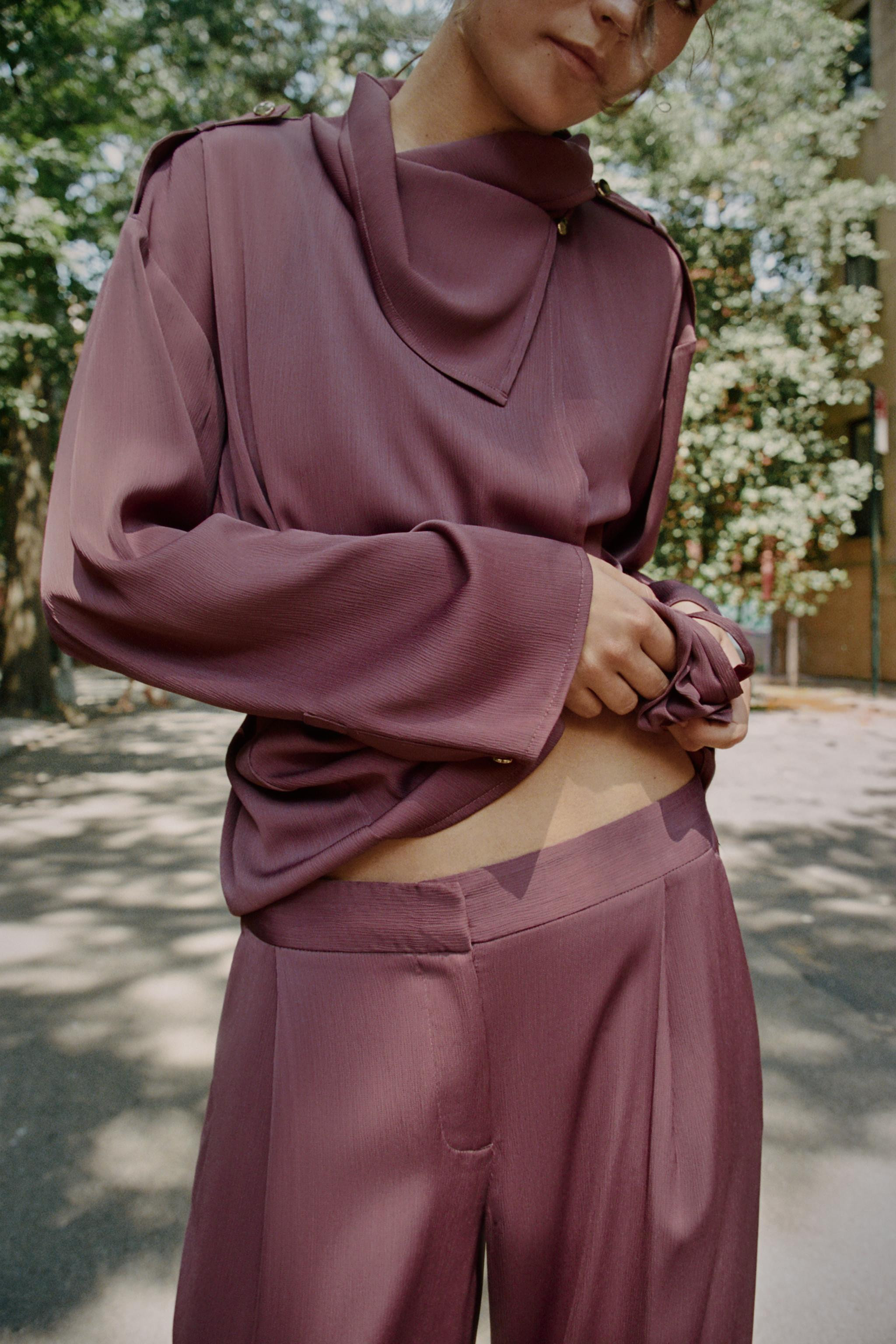 Mid-rise trousers with front pleats and side pockets. Wide leg. Front zip fly, interior button, a... | Zara US