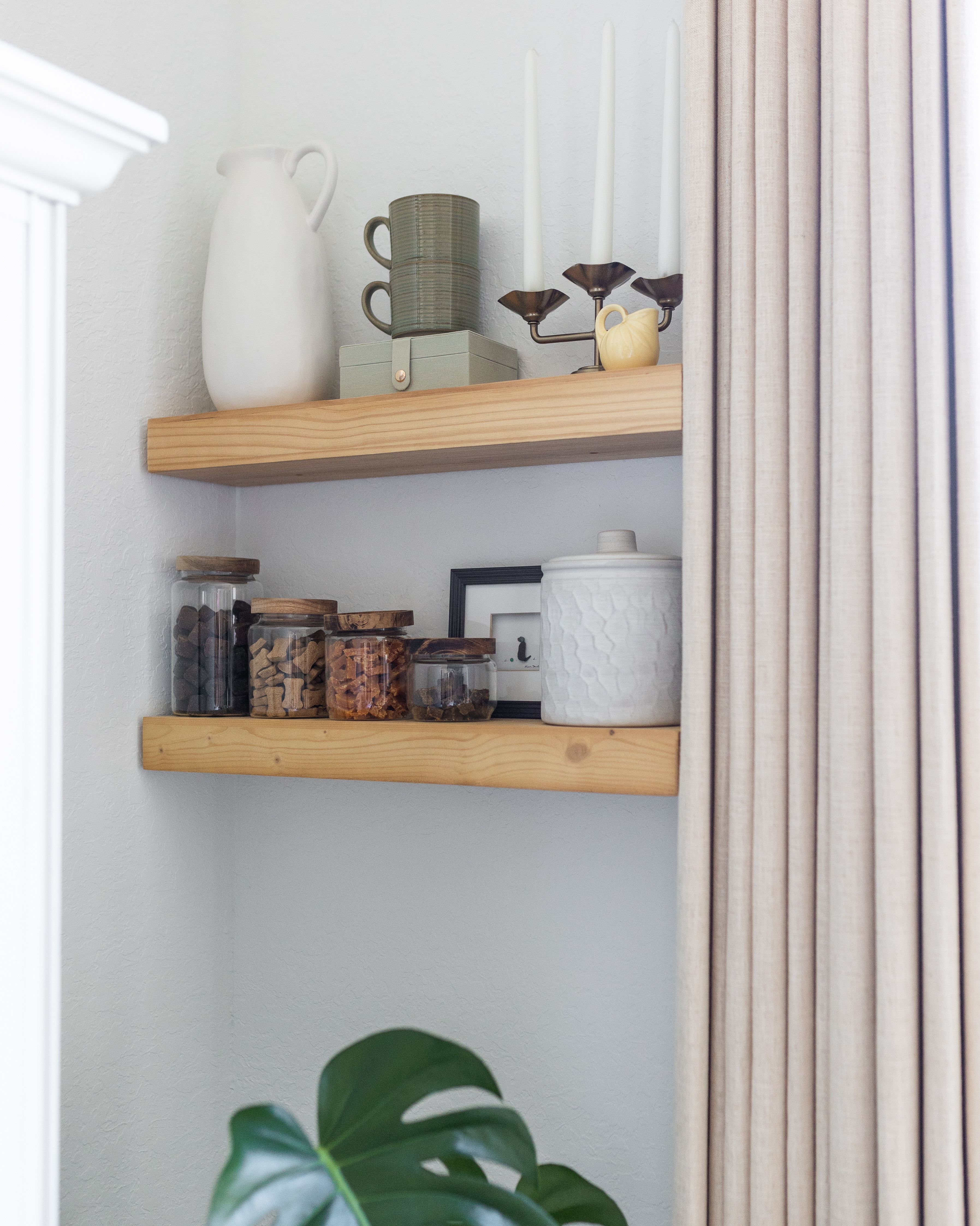 If you're working with a small kitchen, don't overlook the walls. These floating shelves added much-needed storage while giving me a place to display everyday essentials in a way that still feels beautiful.

I use glass jars for dog treats and supplements, stack mugs to save space, and mix in a few decorative pieces to keep the shelves feeling collected instead of cluttered. It's a simple way to maximize storage without sacrificing style. 

 #LTKHome #LTKSaleAlert
