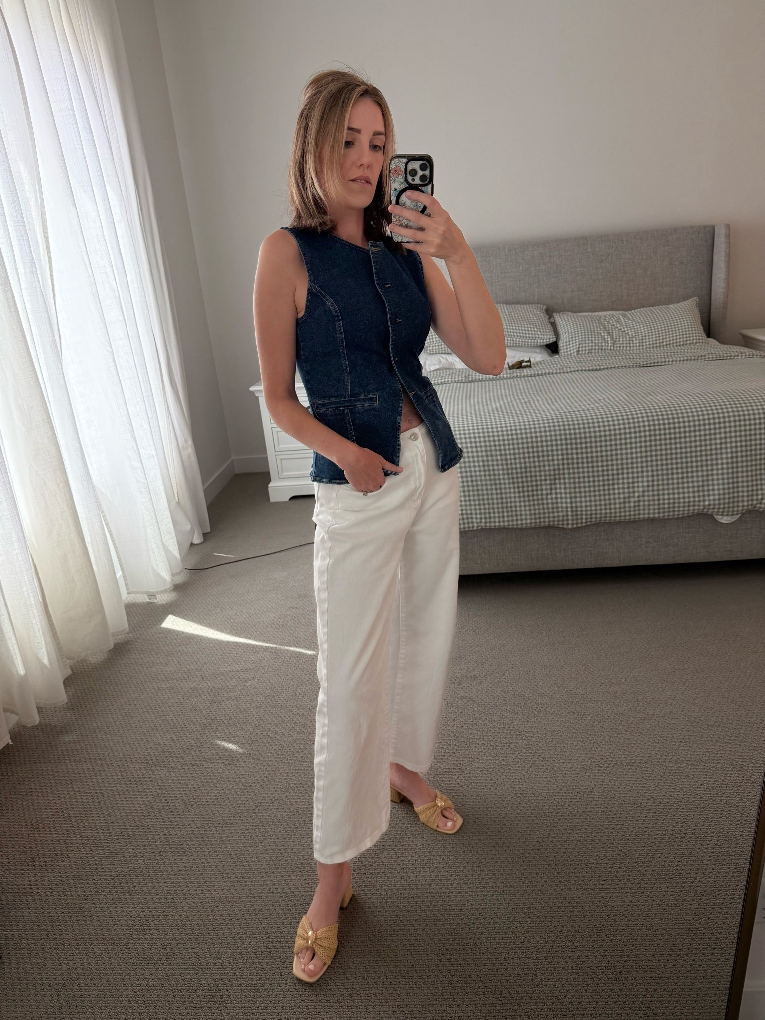 This look is the ultimate transition piece for spring! Combining a structured denim vest with crisp white wide-leg jeans creates a polished, "quiet luxury" vibe that works for everything from school drop-offs to a casual lunch date. The tailored fit of the vest balances out the relaxed silhouette of the pants perfectly.

Amazon Fashion, Spring Outfit Ideas, Denim Vest Trend, White Wide Leg Jeans, Coastal Chic Style, Quiet Luxury Outfits, Millennial Style, Mom Life Fashion, Raffia Sandals, Spring Capsule Wardrobe, LTKunder50, Amazon Finds