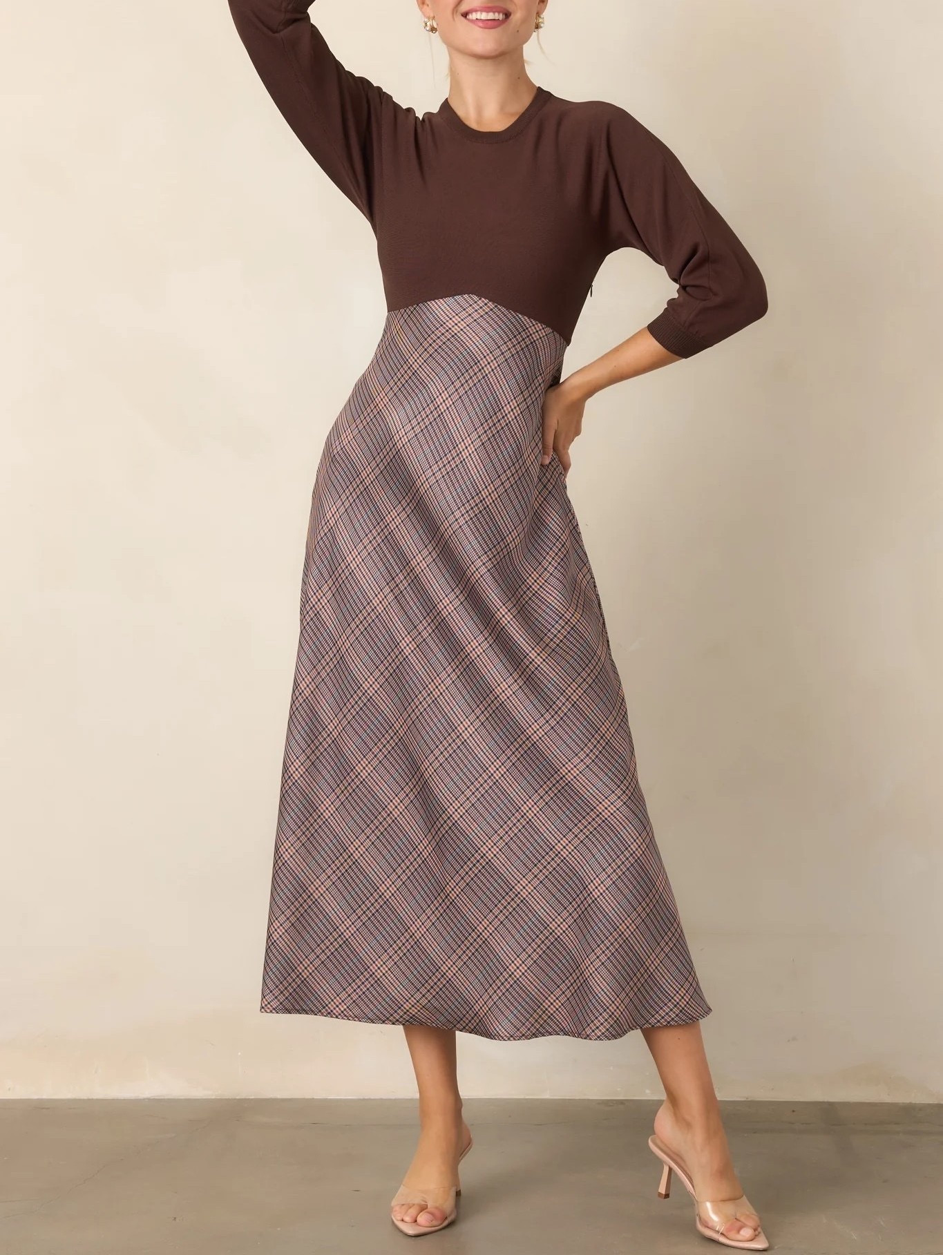 A beautifully polished choice for autumn dressing. 🤎 The PERFECTLY IN PLACE Brown Multi Plaid Knit Bodice Midi Dress combines a rich plaid pattern with a cozy knit bodice and feminine midi silhouette, creating an elegant look for everything from seasonal gatherings to everyday outings. Under $100.

Ideas

* Pair with brown suede ankle boots
* Add a camel coat for a classic autumn look
* Style with knee-high boots and a structured handbag
* Add gold jewelry for a refined finish
* Wear to Thanksgiving gatherings, brunches, or autumn events

Keywords

* brown plaid midi dress
* plaid knit midi dress
* brown plaid dress
* knit bodice midi dress
* plaid midi dress
* women’s midi dress
* autumn plaid dress
* fall plaid dress
* fall outfits women
* autumn dresses women
* midi dresses women 
* brown fall dress
* Thanksgiving outfit

#LTKootd #LTKgrwm #LTKSeasonal