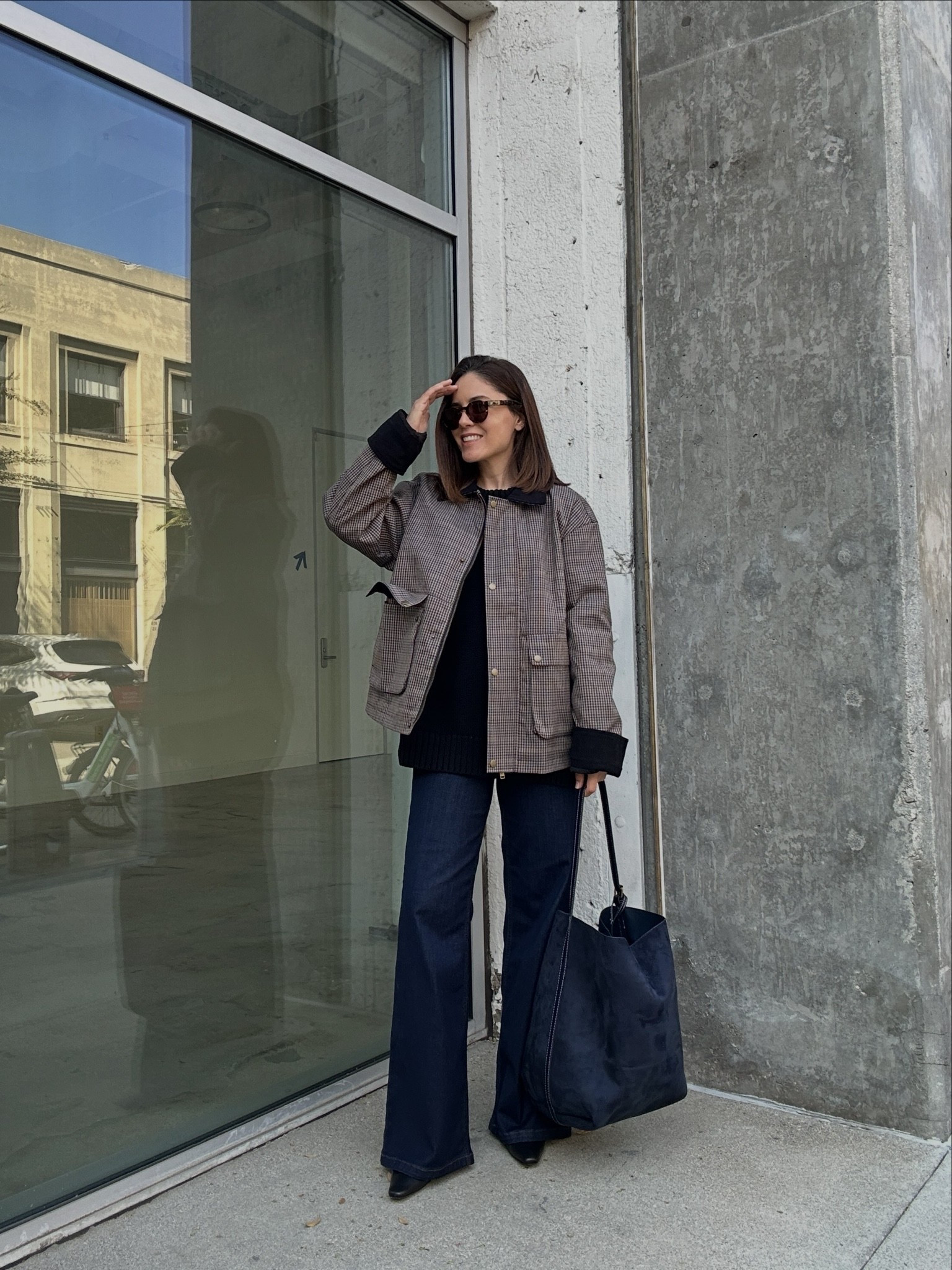 Love how a simple layered top holds up well with wide legs. Keep the base clean for a chic look.
