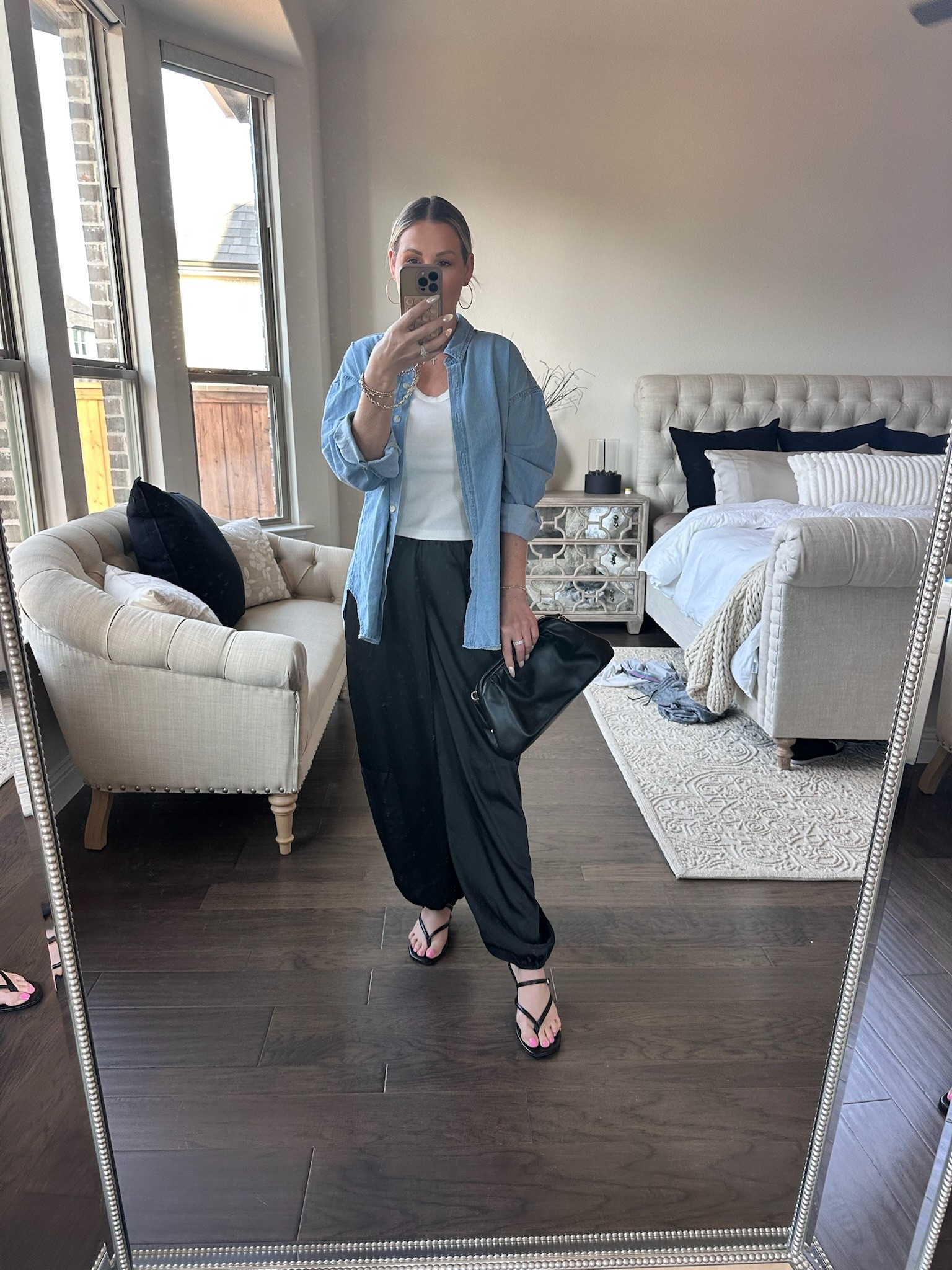 Coffee runs and pedicure plans with my girls ☕️✨

This is exactly the kind of outfit I reach for during spring break — easy, comfortable, but still feeling put together for real life moments.

Relaxed black pants, a simple white tank, and an oversized chambray button-down layered on top for that effortless, slightly undone feel. It’s one of those combinations that always works.

The strappy sandals keep it minimal and feminine, and the black clutch adds just enough polish to take it from casual to styled.

Simple pieces, styled intentionally — because polished doesn’t have to feel complicated.

Everything linked for you 🤍

#everydayelevated #over40style #effortlessstyle #springoutfits #highlowfashion


#LTKootd #LTKgrwm #LTKdayinmylife