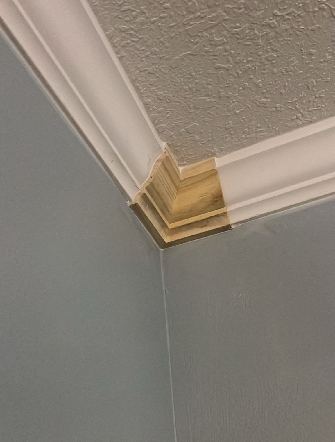 These corner pieces are absolutely miraculous! Keeps you from having to get the perfect cut! This visual is obviously still in the works of being completed, but I wanted to be able to show you so you could see the separate pieces before it was painted. The molding trim, just slides into each side of this corner block absolutely genius! 
￼

#LTKHome